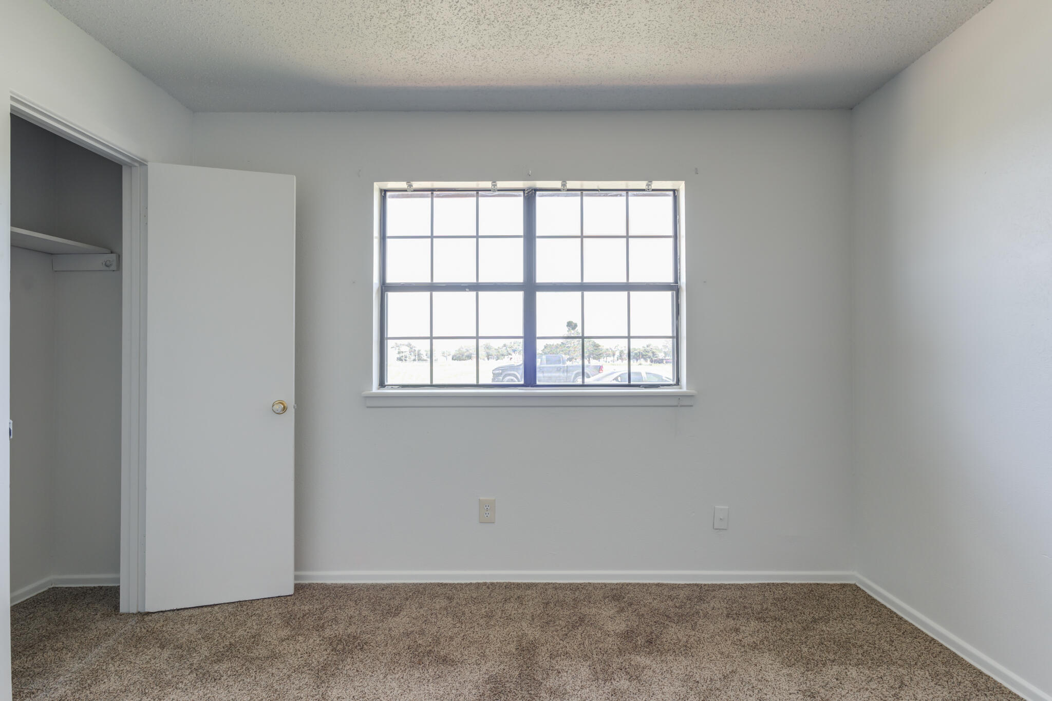 1313 Adrian Street Lubbock, TX 79403 - Photo 21 of 26 an empty room with a window