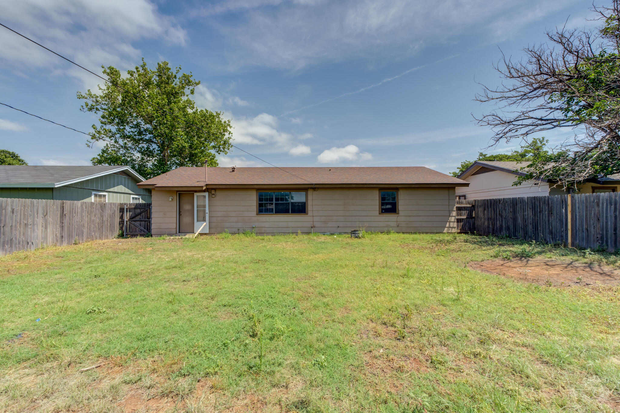 1313 Adrian Street Lubbock, TX 79403 - Photo 26 of 26 a front view of a house with a garden