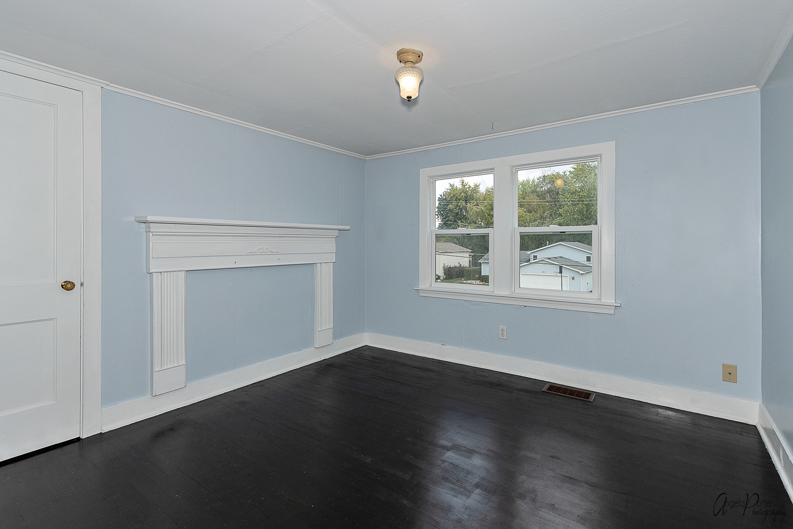 34 Lippincott Road Fox Lake, IL 60020 - Photo 22 of 24 a view of an empty room with wooden floor and a window