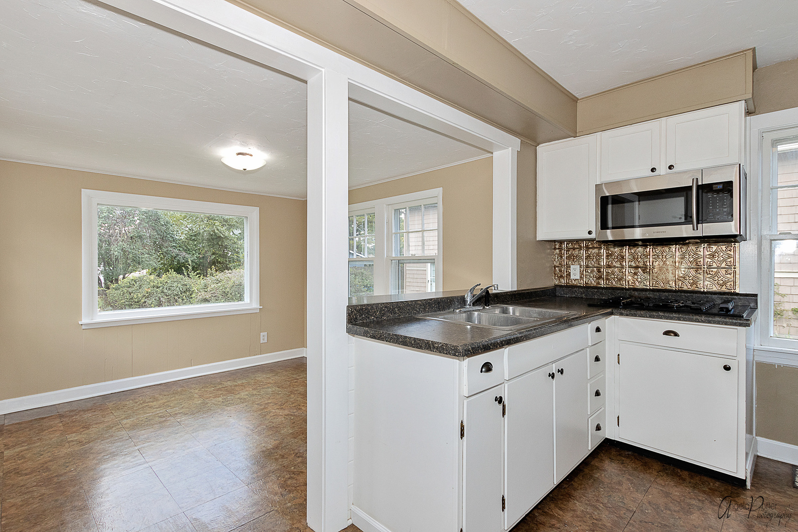 34 Lippincott Road Fox Lake, IL 60020 - Photo 7 of 24 a kitchen with granite countertop a sink and a stove