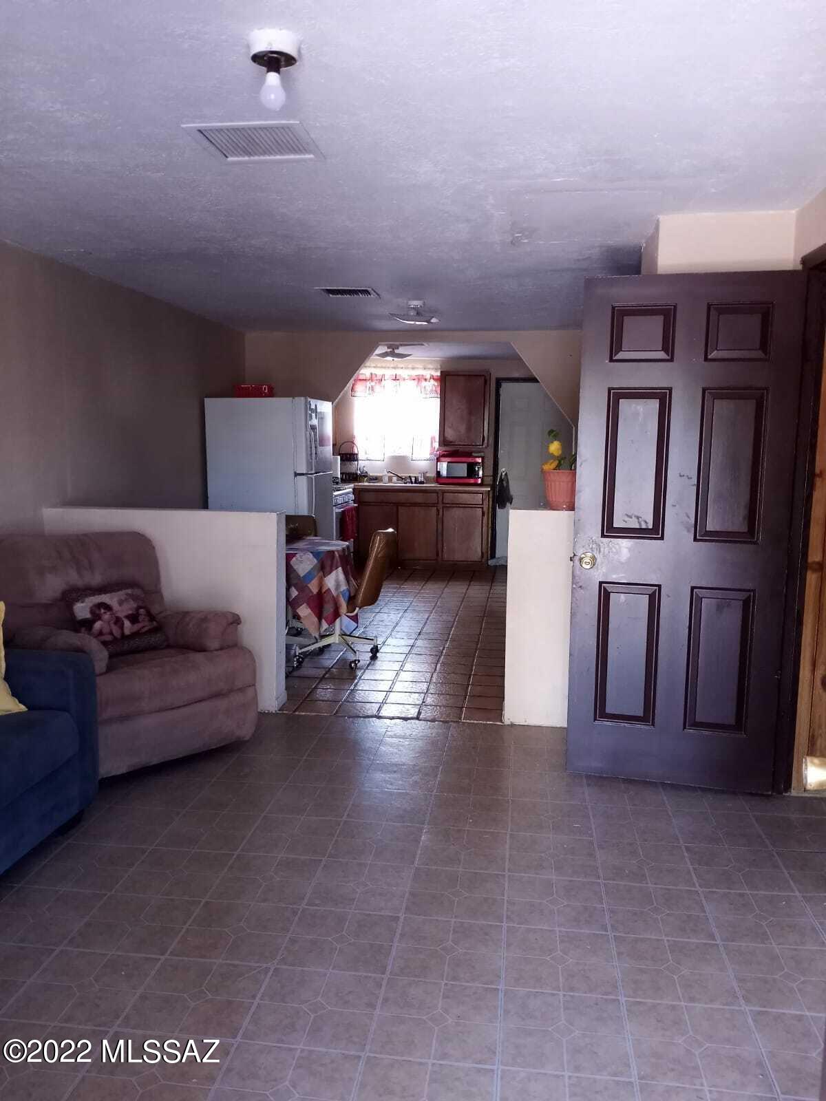 Undisclosed Address Douglas, AZ 85607 - Photo 12 of 16 a living room with furniture and a fireplace