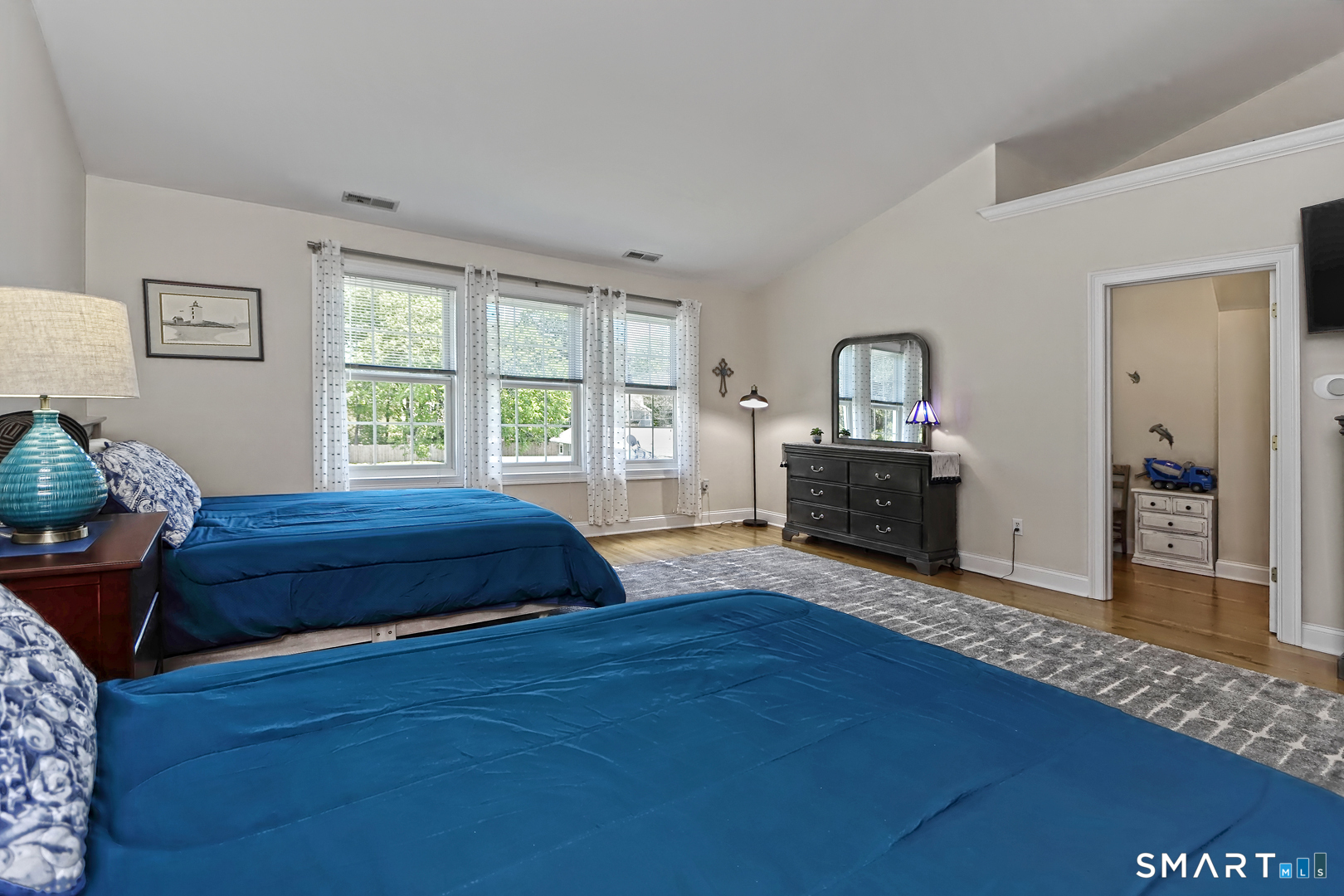 102 Lantern Court, Unit 102 Clinton, CT 06413 - Photo 32 of 36 a bedroom with a bed and a dresser