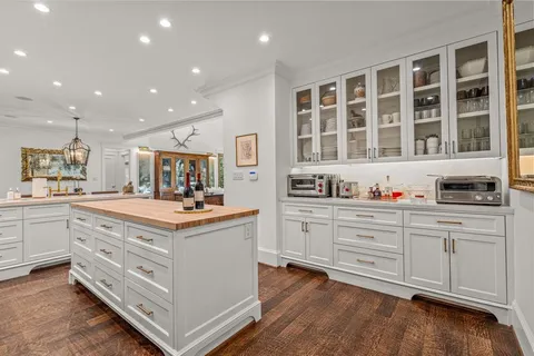 a kitchen with stainless steel appliances granite countertop a stove and cabinets