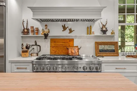 a view of cabinet with white cabinets