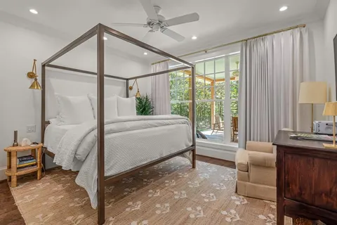 a spacious bedroom with a large bed and a window