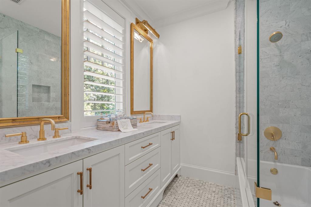 877 Private Road 7893 Mineola, TX 75773 - Photo 26 of 40 a bathroom with a granite countertop sink two mirror and a shower