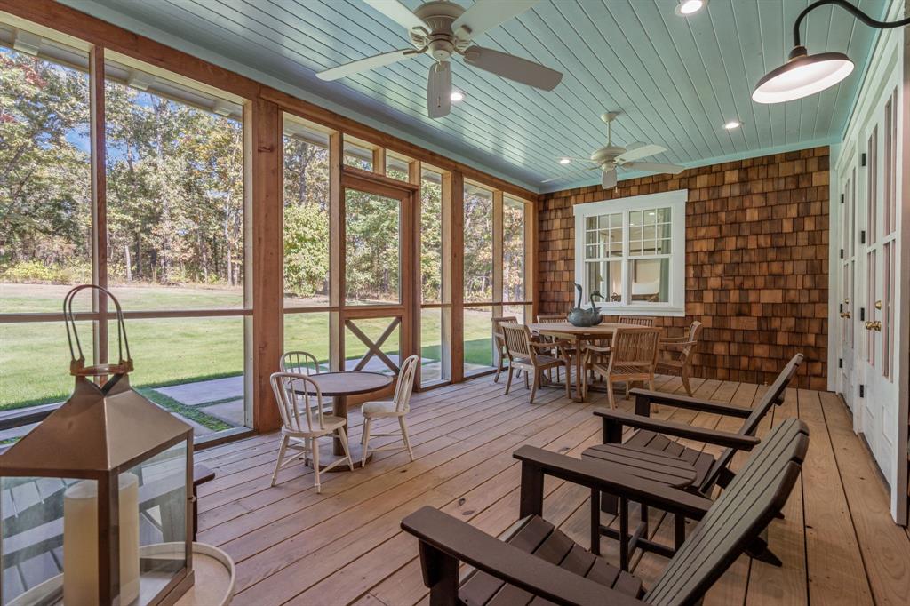 877 Private Road 7893 Mineola, TX 75773 - Photo 30 of 40 a living room with furniture and a floor to ceiling window