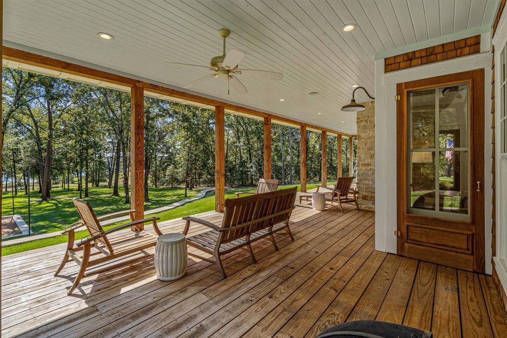 877 Private Road 7893 Mineola, TX 75773 - Photo 31 of 40 a view of a patio with wooden floor and iron stairs