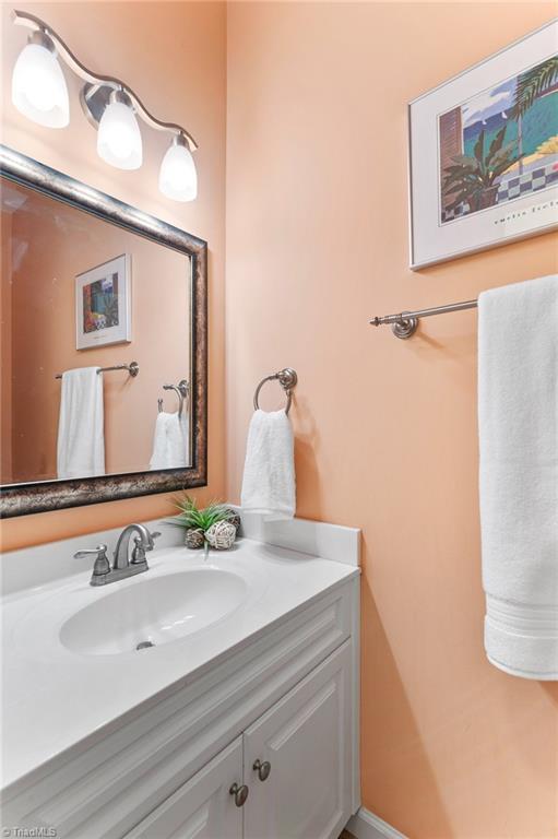 2505 Burch Point High Point, NC 27265 - Photo 17 of 39 Main level guest bathroom has been updated with new lighting.