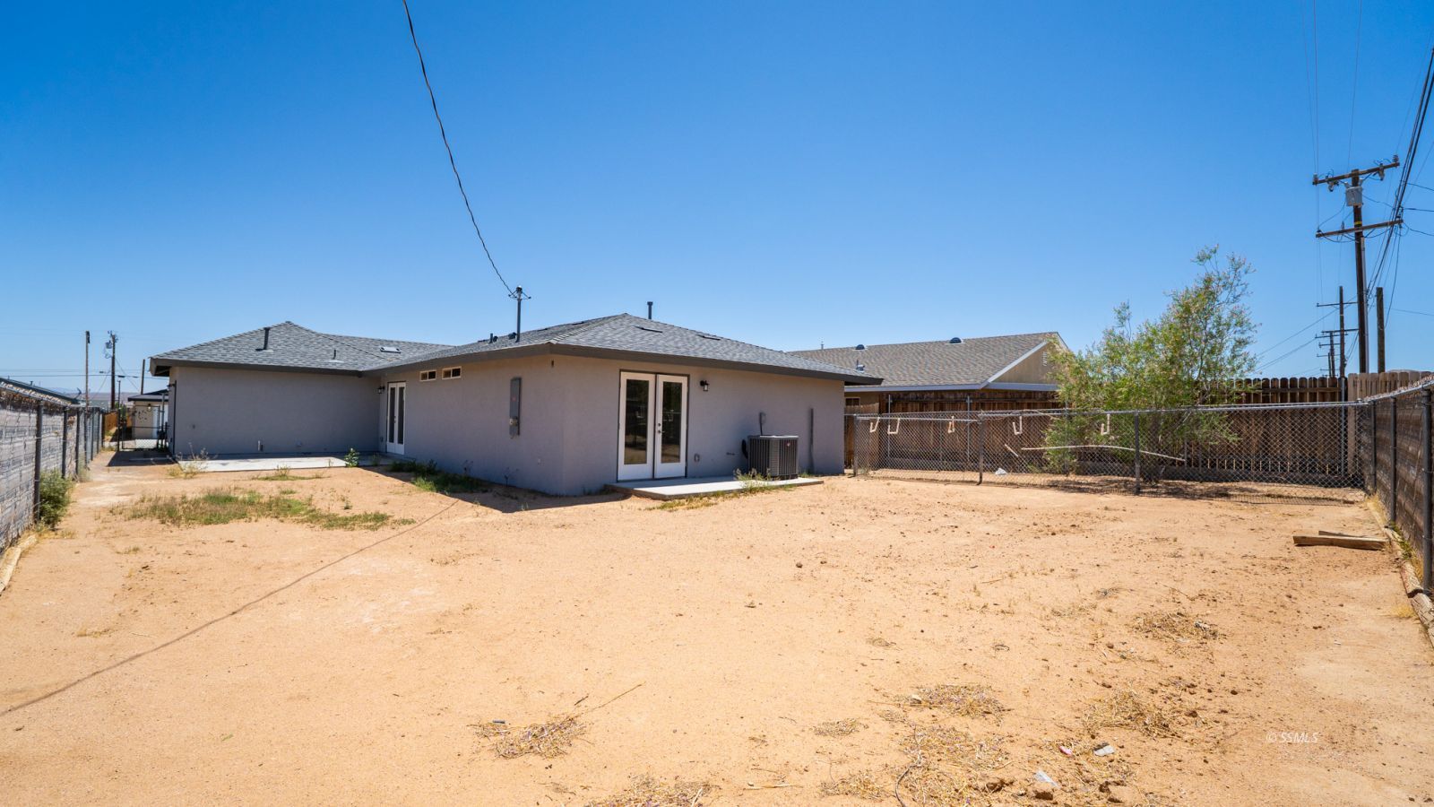 1529 Mayo Street Ridgecrest, CA 93555 - Photo 20 of 22 a view of a house with snow in the yard