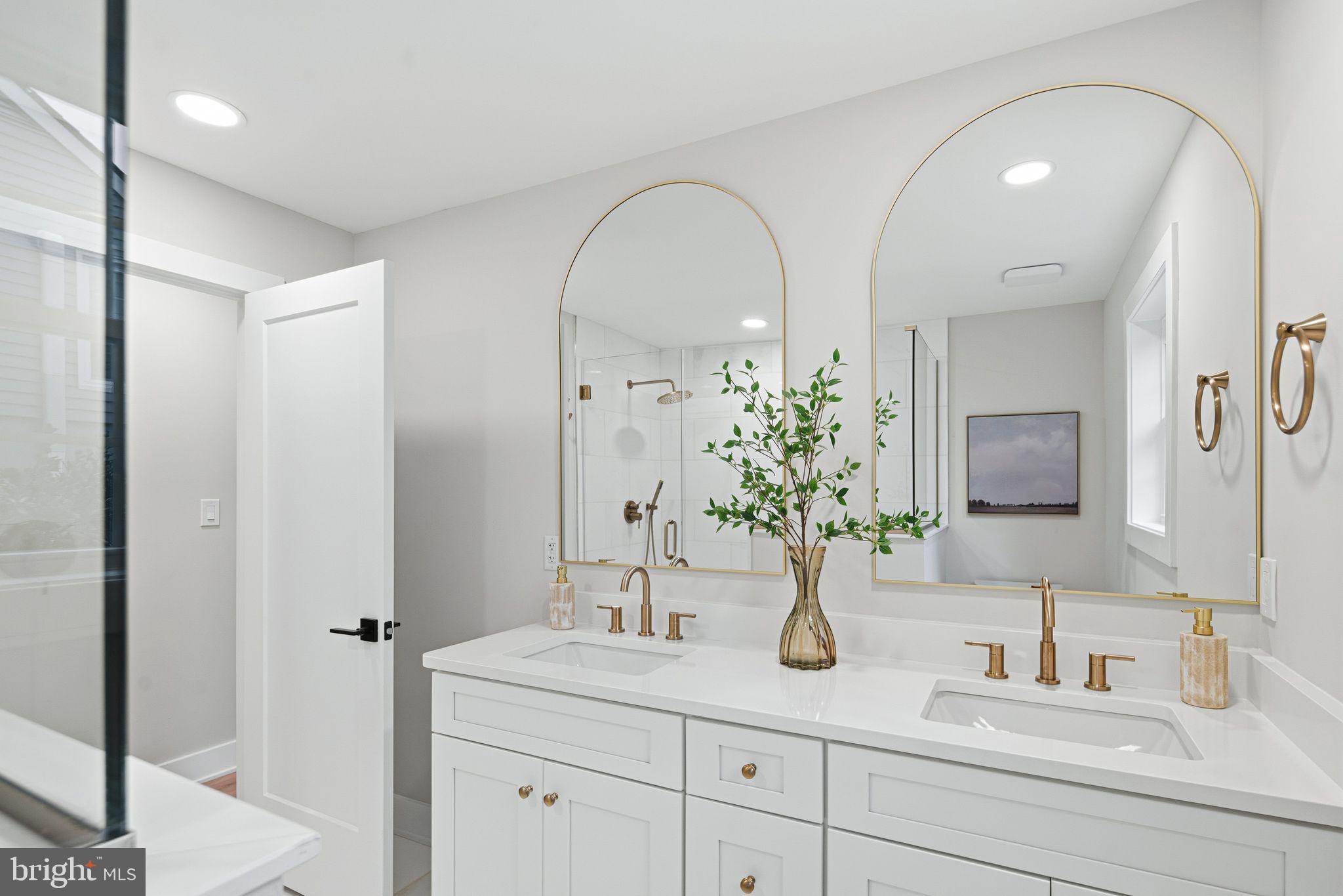 428 Mansfield Avenue Haddonfield, NJ 08033 - Photo 19 of 37 a bathroom with a granite countertop sink and a mirror