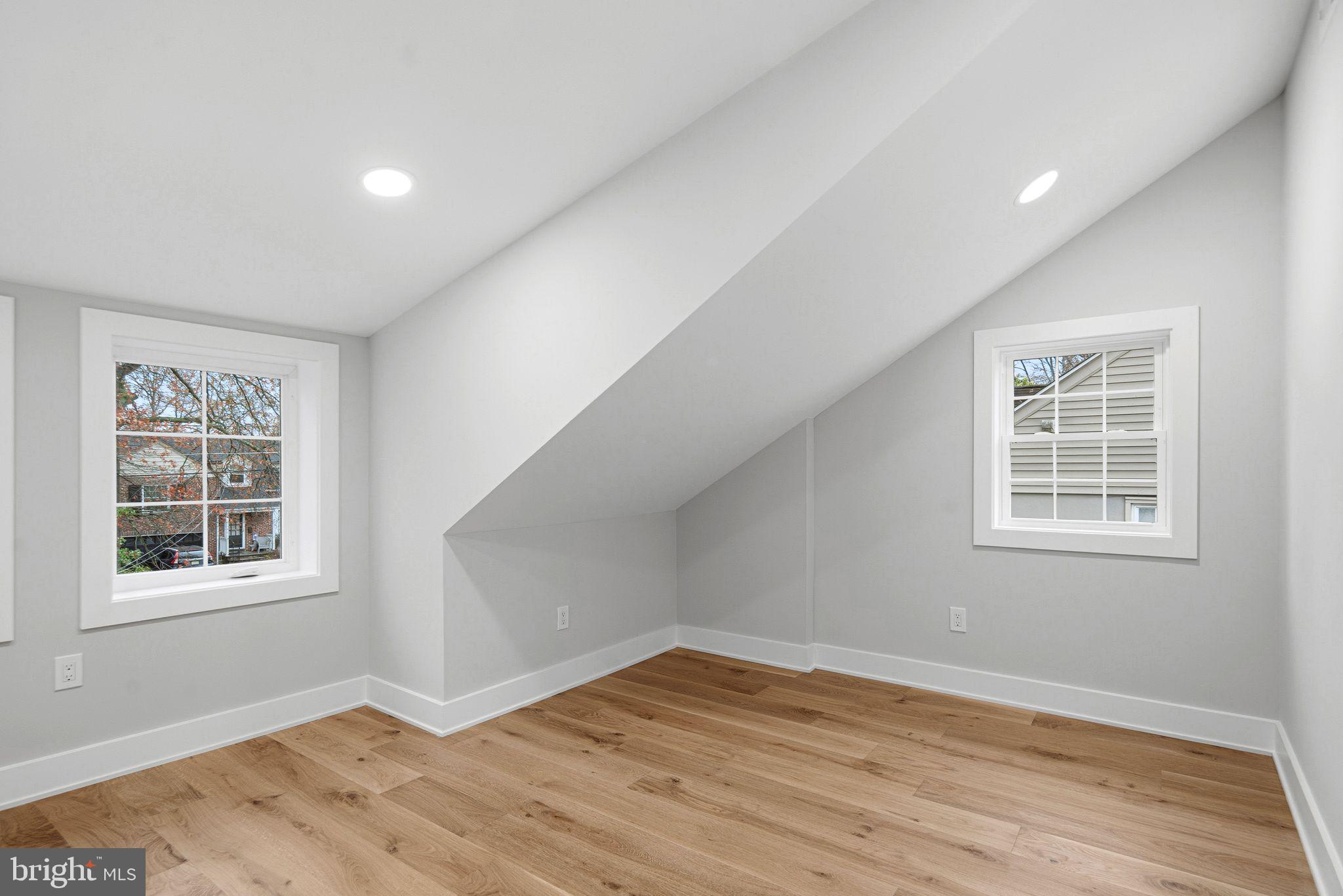428 Mansfield Avenue Haddonfield, NJ 08033 - Photo 21 of 37 an empty room with wooden floor and windows