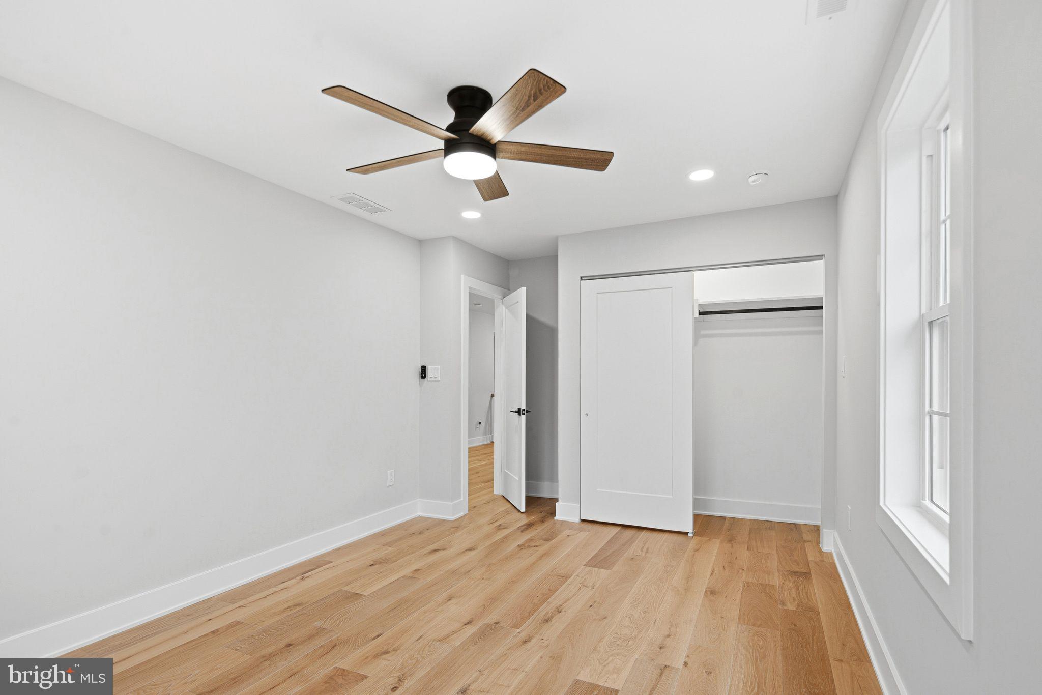 428 Mansfield Avenue Haddonfield, NJ 08033 - Photo 25 of 37 a view of an empty room with wooden floor and a window