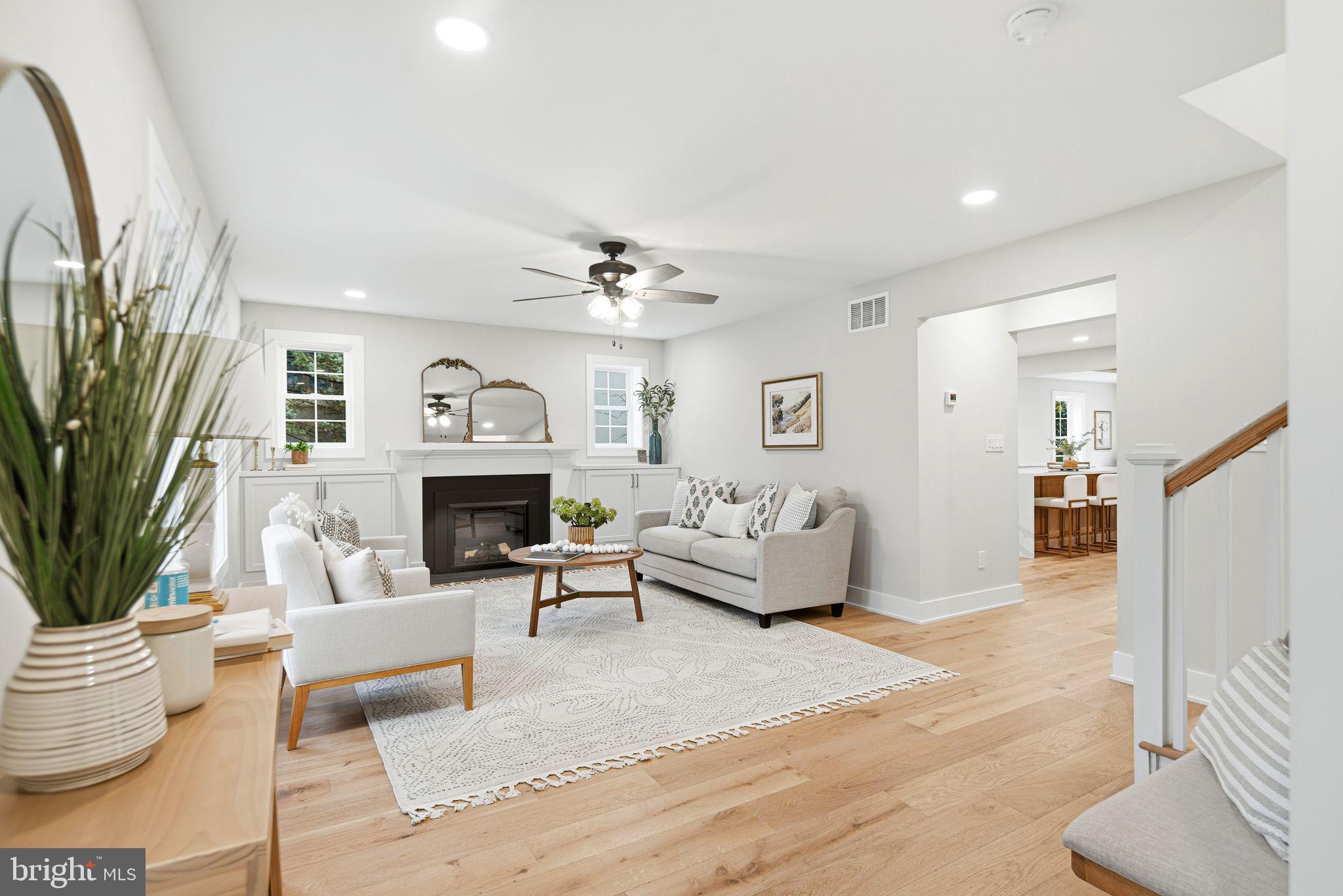 428 Mansfield Avenue Haddonfield, NJ 08033 - Photo 3 of 37 a living room with furniture a fireplace and a potted plant