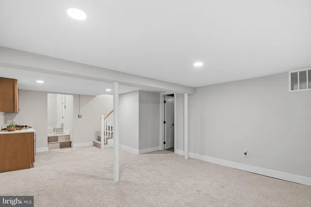 a view of a livingroom with a kitchen