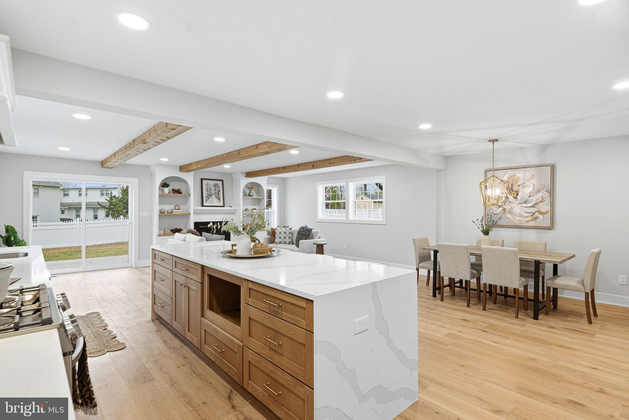 428 Mansfield Avenue Haddonfield, NJ 08033 - Photo 9 of 37 a living room with stainless steel appliances kitchen island granite countertop a sink and wooden floor