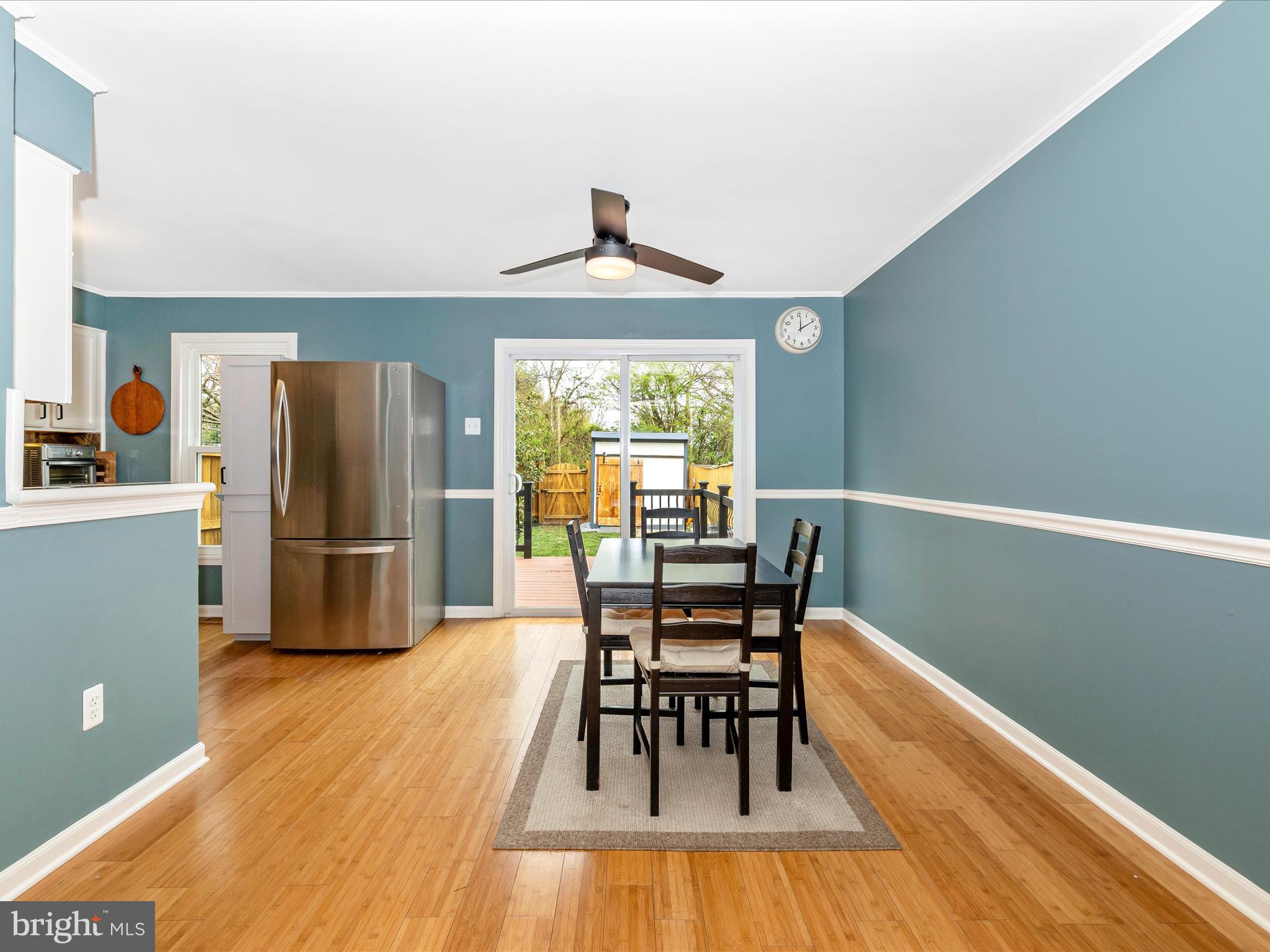 1127 Daffodil Drive Frederick, MD 21703 - Photo 12 of 61 a view of a dining room with furniture window and wooden floor