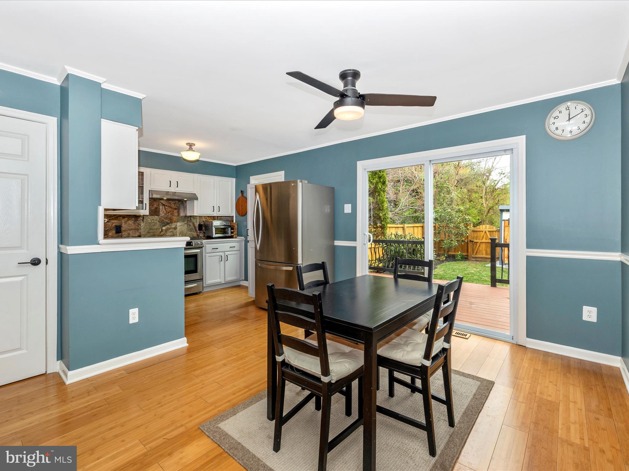 1127 Daffodil Drive Frederick, MD 21703 - Photo 14 of 61 a view of a dining room with furniture window and wooden floor