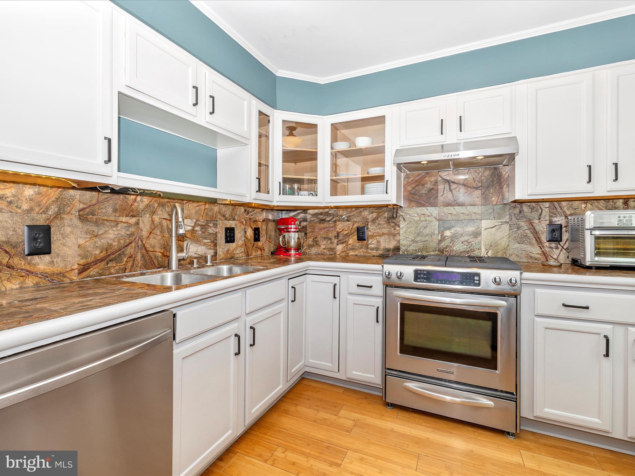 1127 Daffodil Drive Frederick, MD 21703 - Photo 17 of 61 a kitchen with stainless steel appliances granite countertop a stove and white cabinets