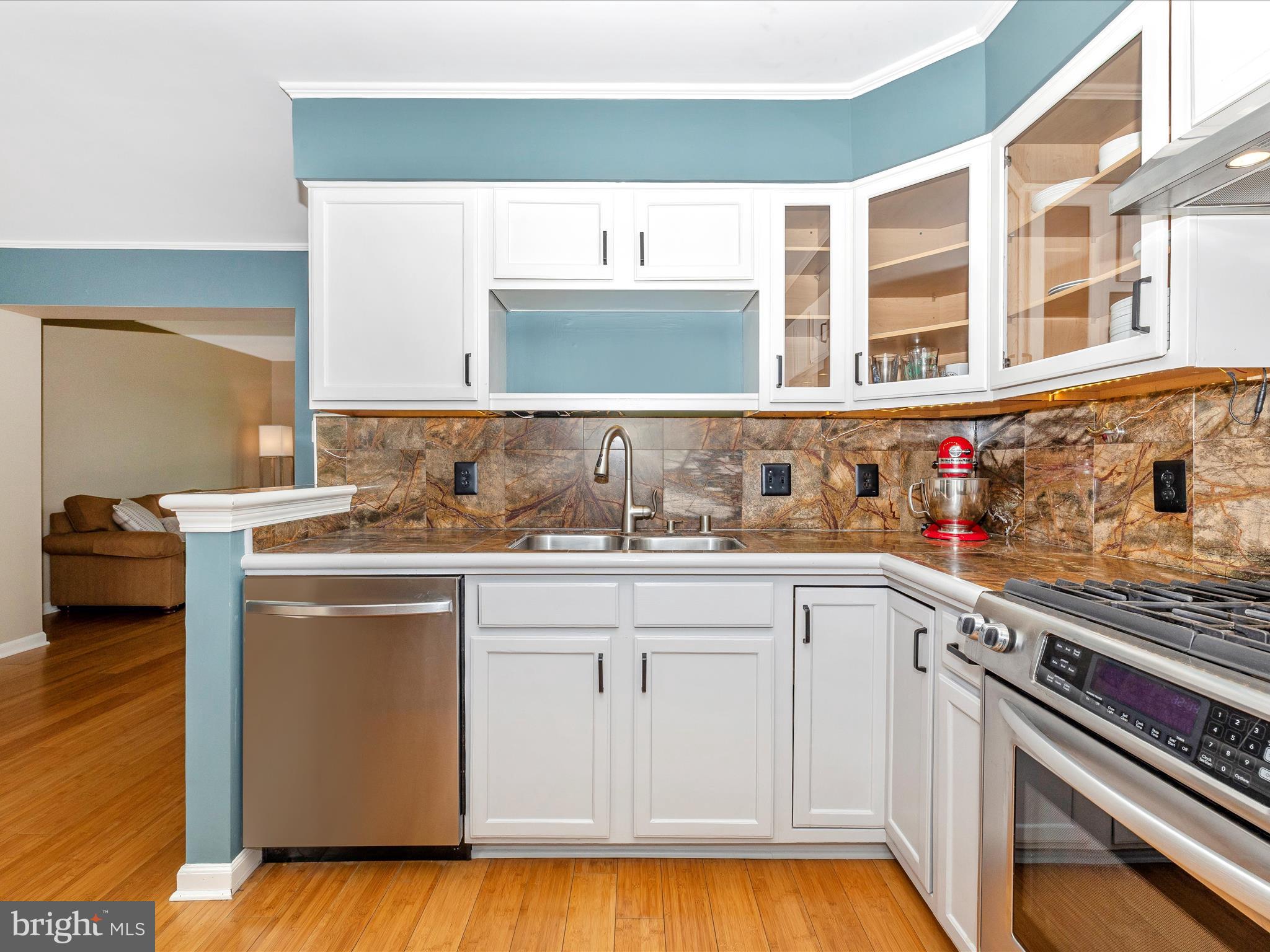 1127 Daffodil Drive Frederick, MD 21703 - Photo 22 of 61 a kitchen with stainless steel appliances granite countertop a stove and a sink