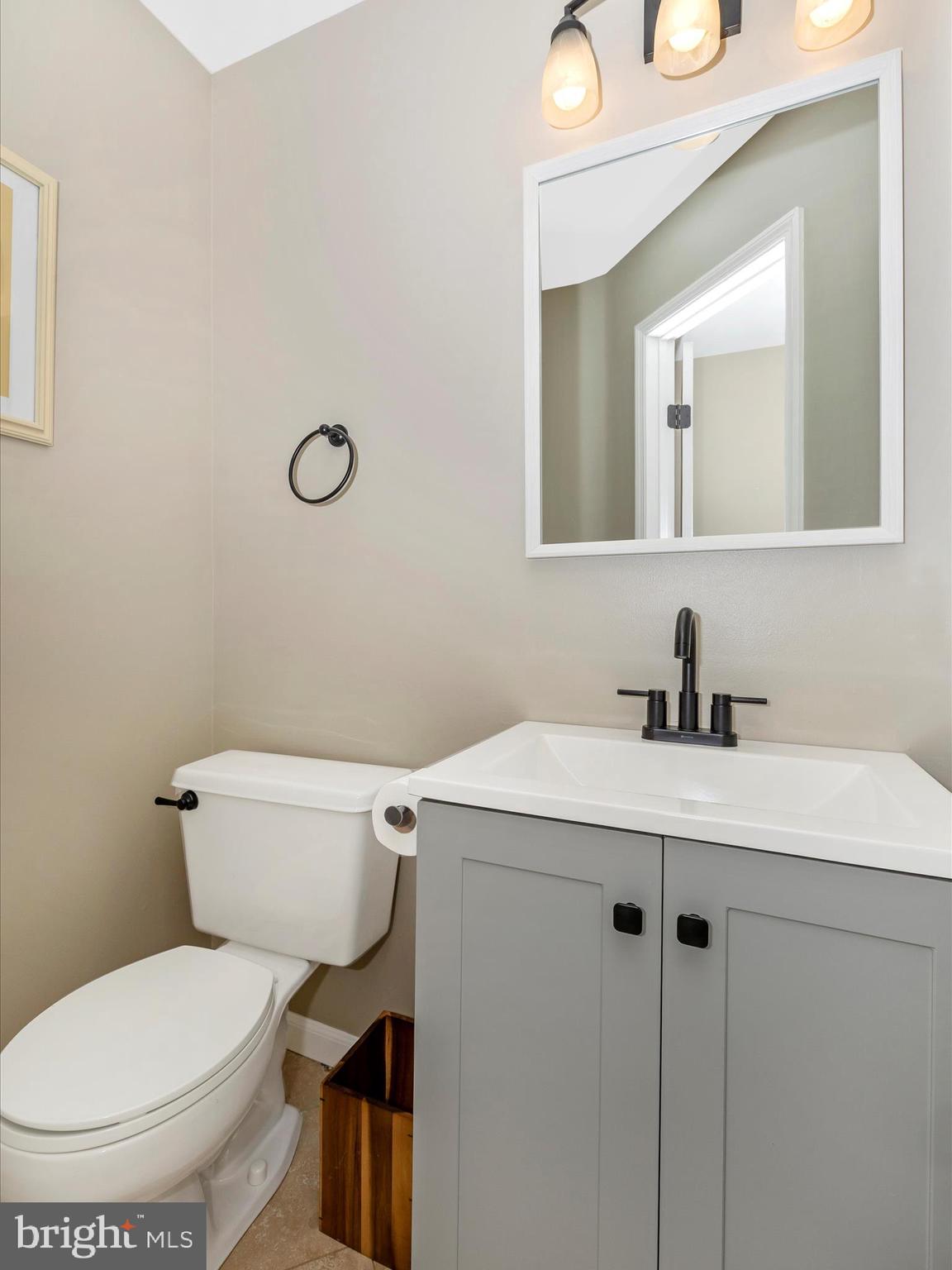 1127 Daffodil Drive Frederick, MD 21703 - Photo 23 of 61 a bathroom with a toilet sink and mirror