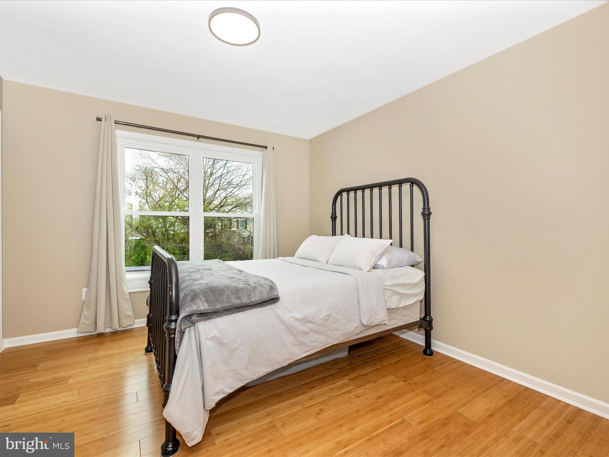 1127 Daffodil Drive Frederick, MD 21703 - Photo 30 of 61 a large bed sitting in a bedroom next to a window