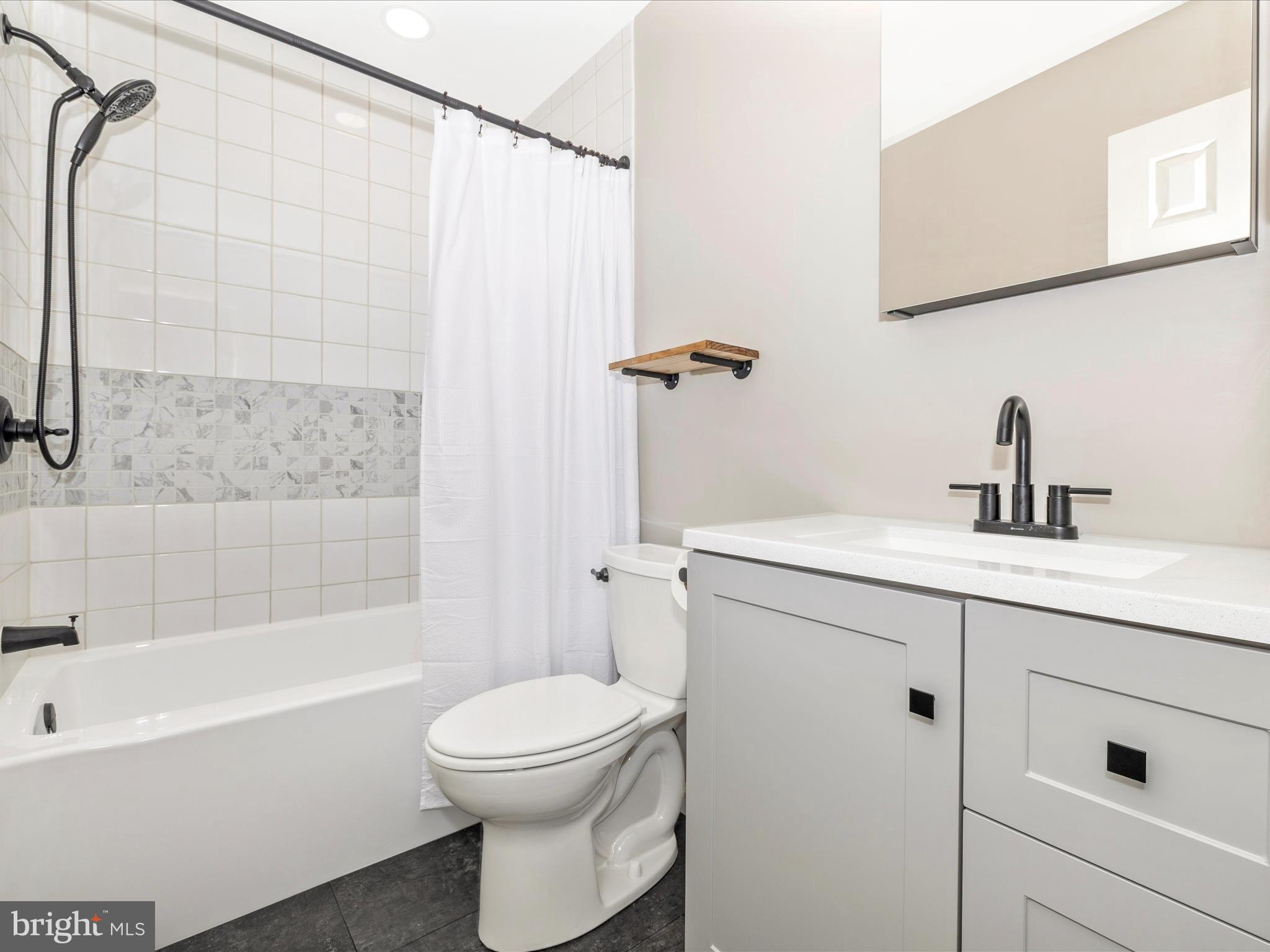 1127 Daffodil Drive Frederick, MD 21703 - Photo 35 of 61 a bathroom with a sink a toilet and shower