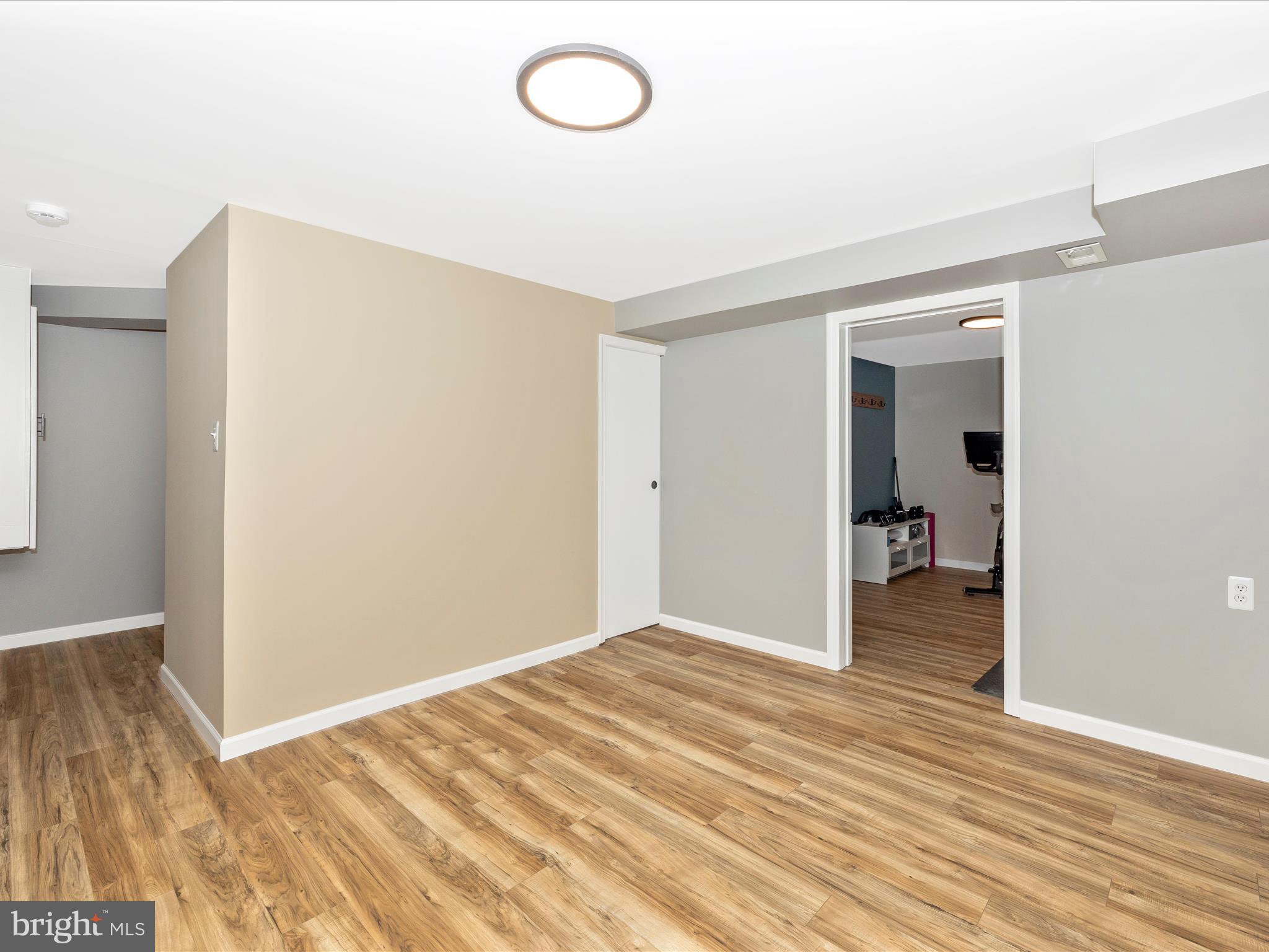 1127 Daffodil Drive Frederick, MD 21703 - Photo 37 of 61 a view of empty room with wooden floor
