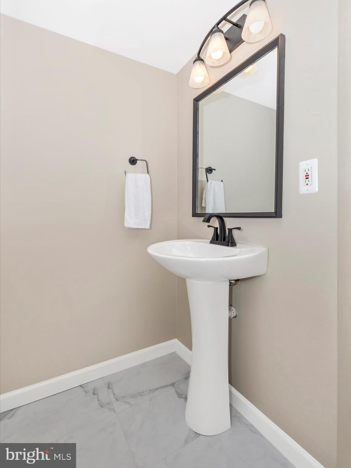 1127 Daffodil Drive Frederick, MD 21703 - Photo 41 of 61 a bathroom with a sink a mirror and vanity