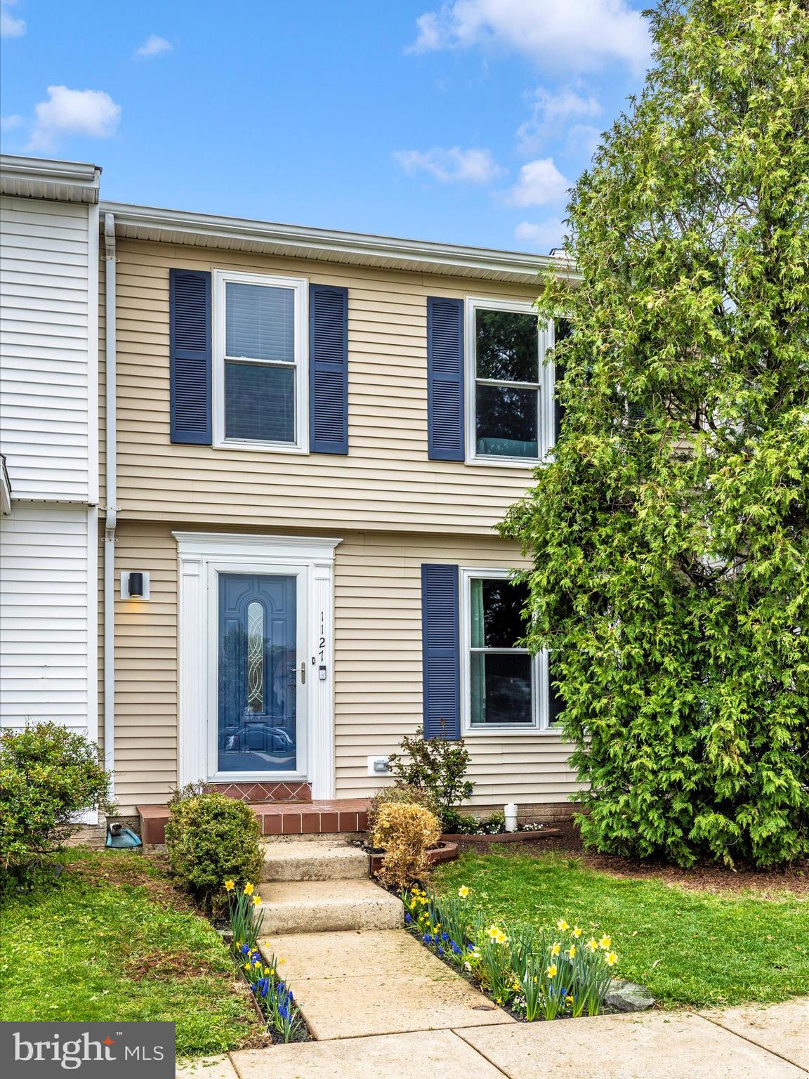 1127 Daffodil Drive Frederick, MD 21703 - Photo 42 of 61 a front view of a house with garden
