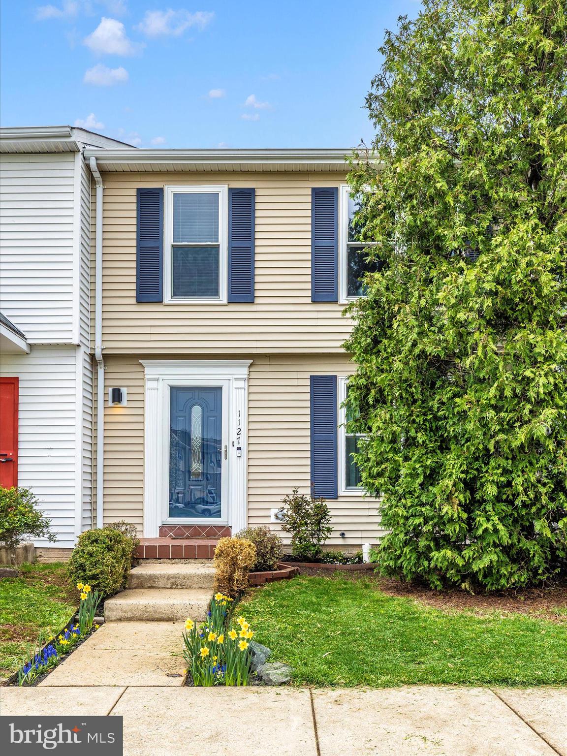 1127 Daffodil Drive Frederick, MD 21703 - Photo 44 of 61 a front view of a house with a yard