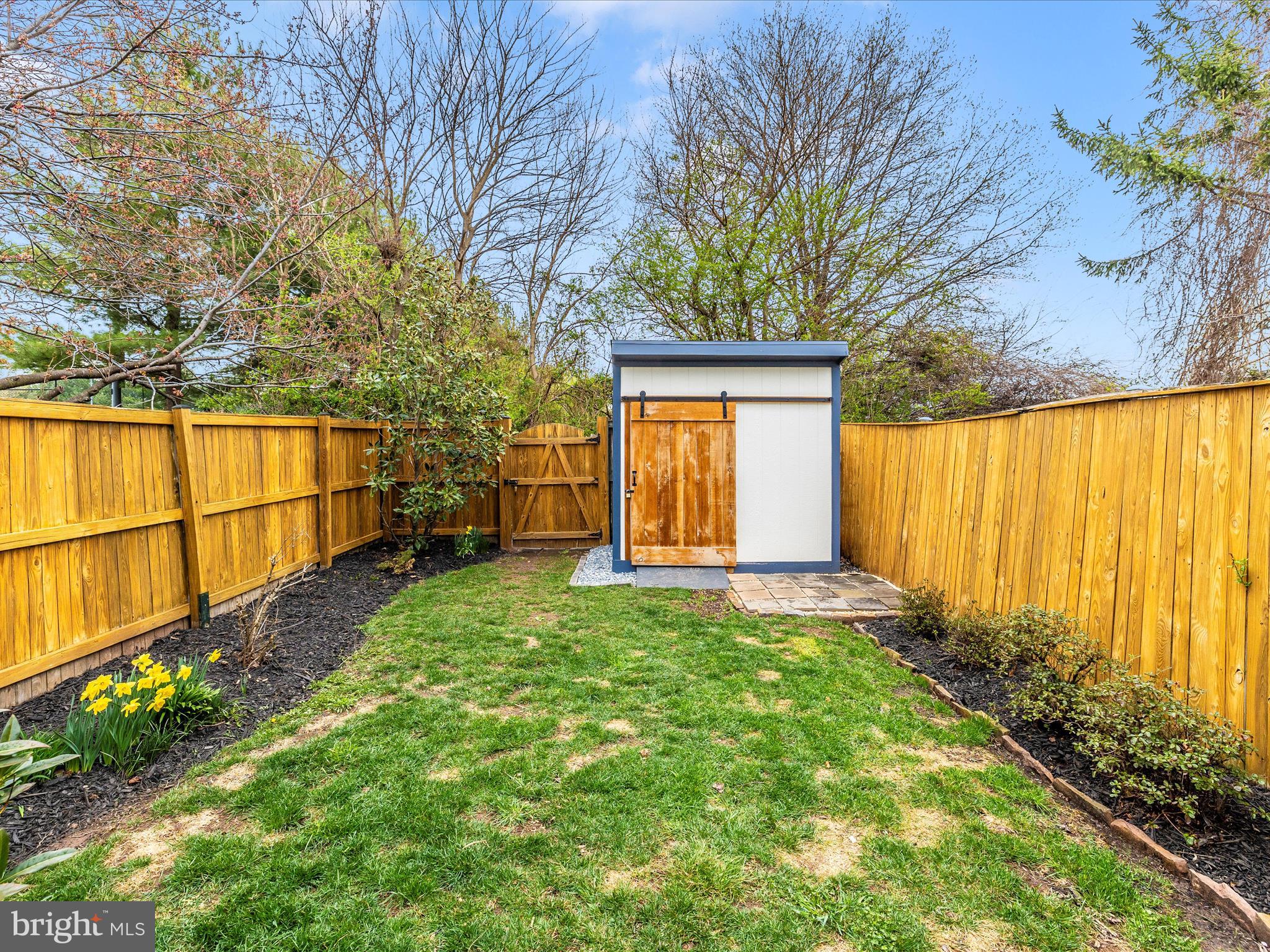 1127 Daffodil Drive Frederick, MD 21703 - Photo 46 of 61 a view of backyard with tub and trees
