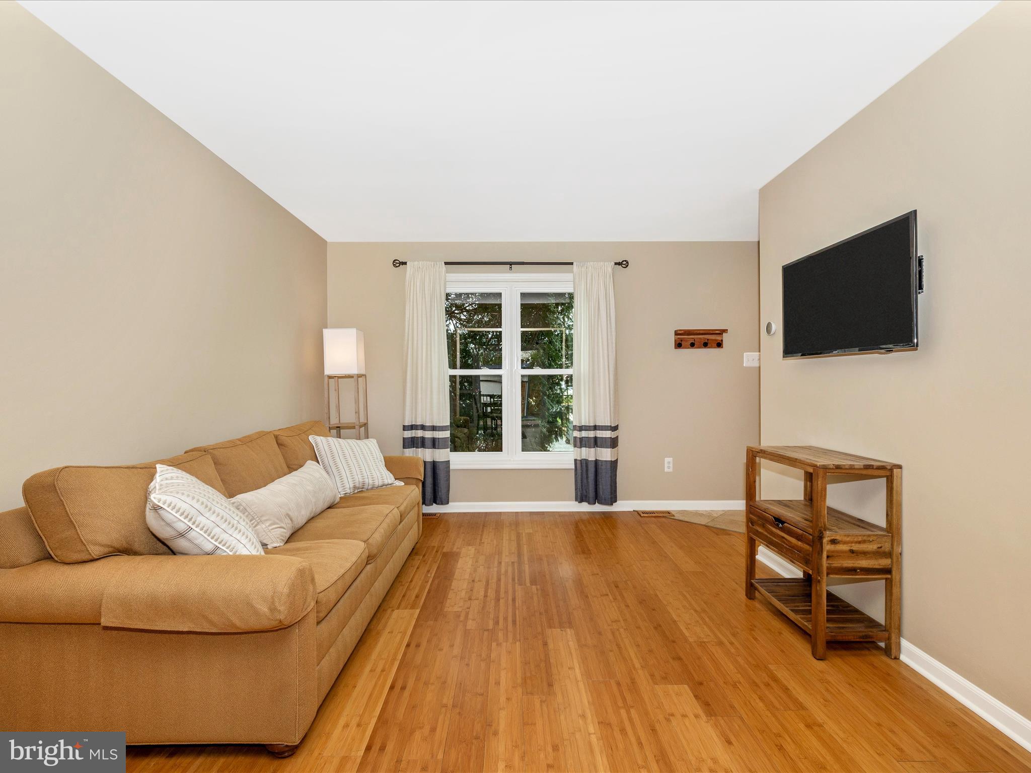 1127 Daffodil Drive Frederick, MD 21703 - Photo 6 of 61 a living room with furniture and a flat screen tv