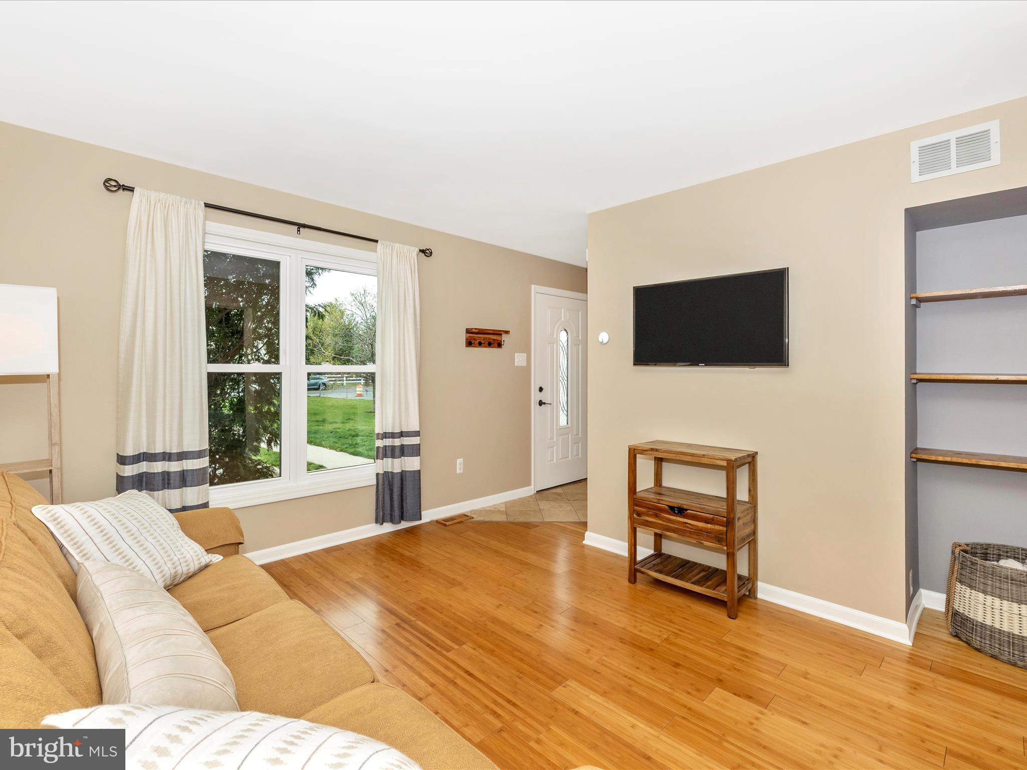 1127 Daffodil Drive Frederick, MD 21703 - Photo 8 of 61 a bedroom with a bed and a flat screen tv