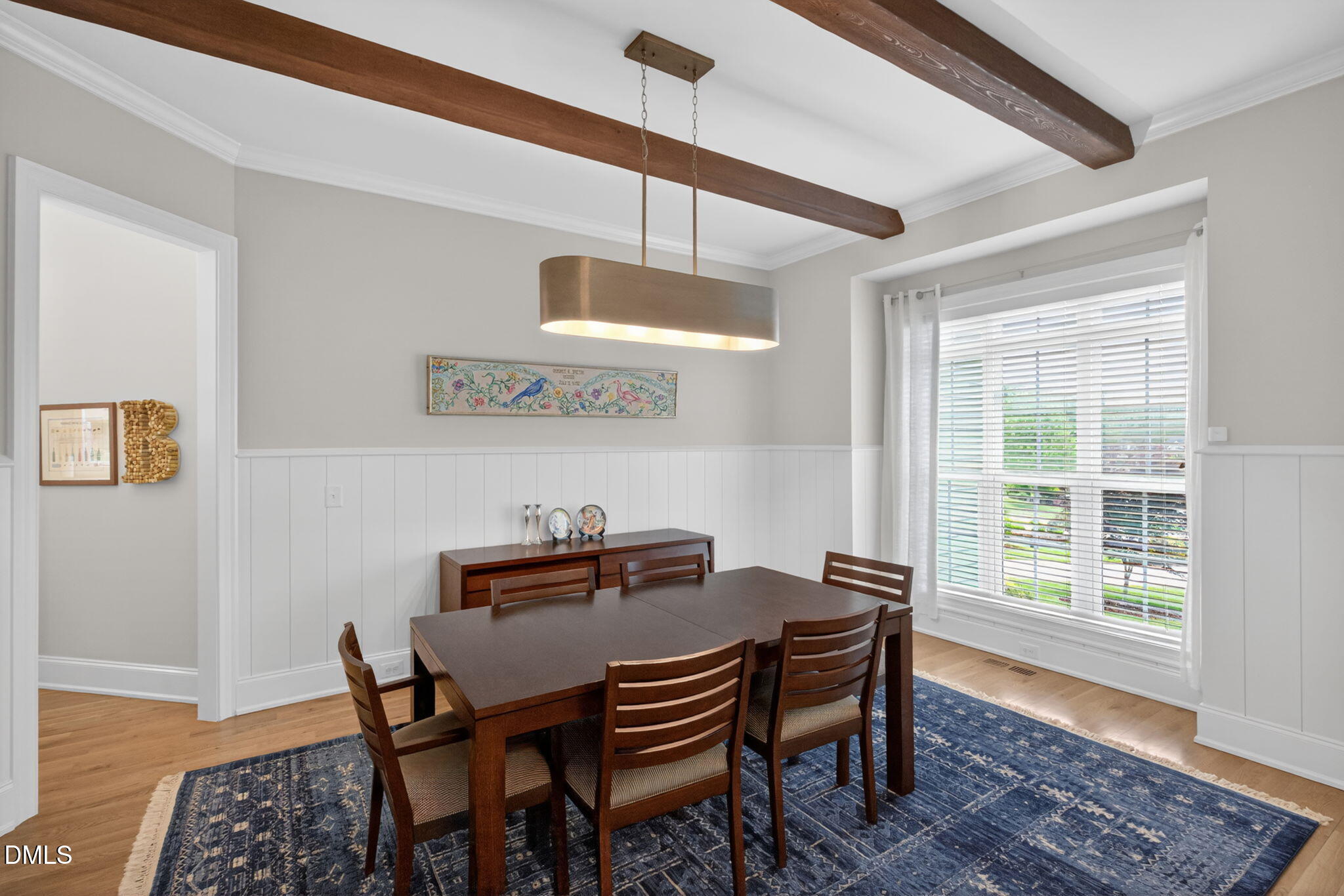 6901 Ray Family Farm Court Raleigh, NC 27613 - Photo 5 of 52 a view of a dining room with furniture window and wooden floor