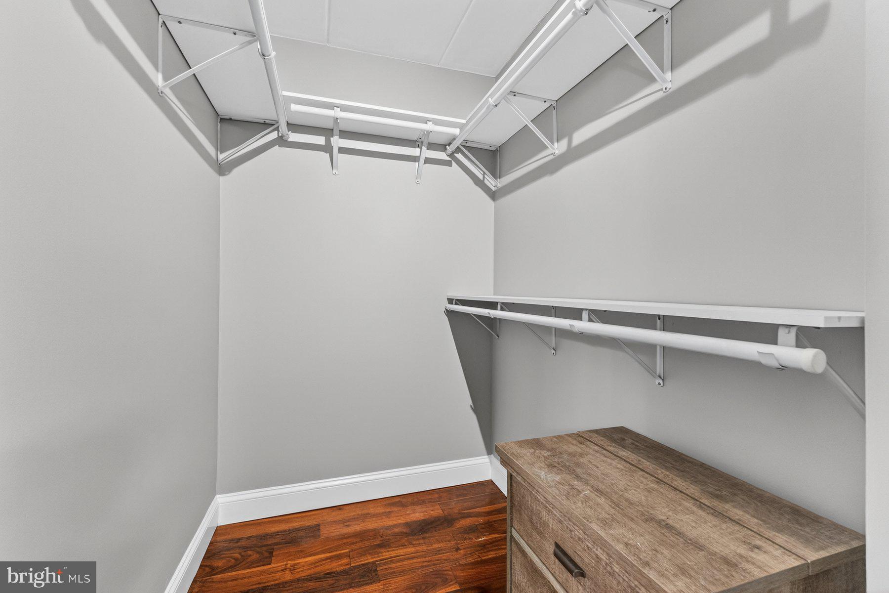 2330 Freetown Court, Unit 4/1B Reston, VA 20191 - Photo 15 of 26 Walk-in closet in primary bedroom