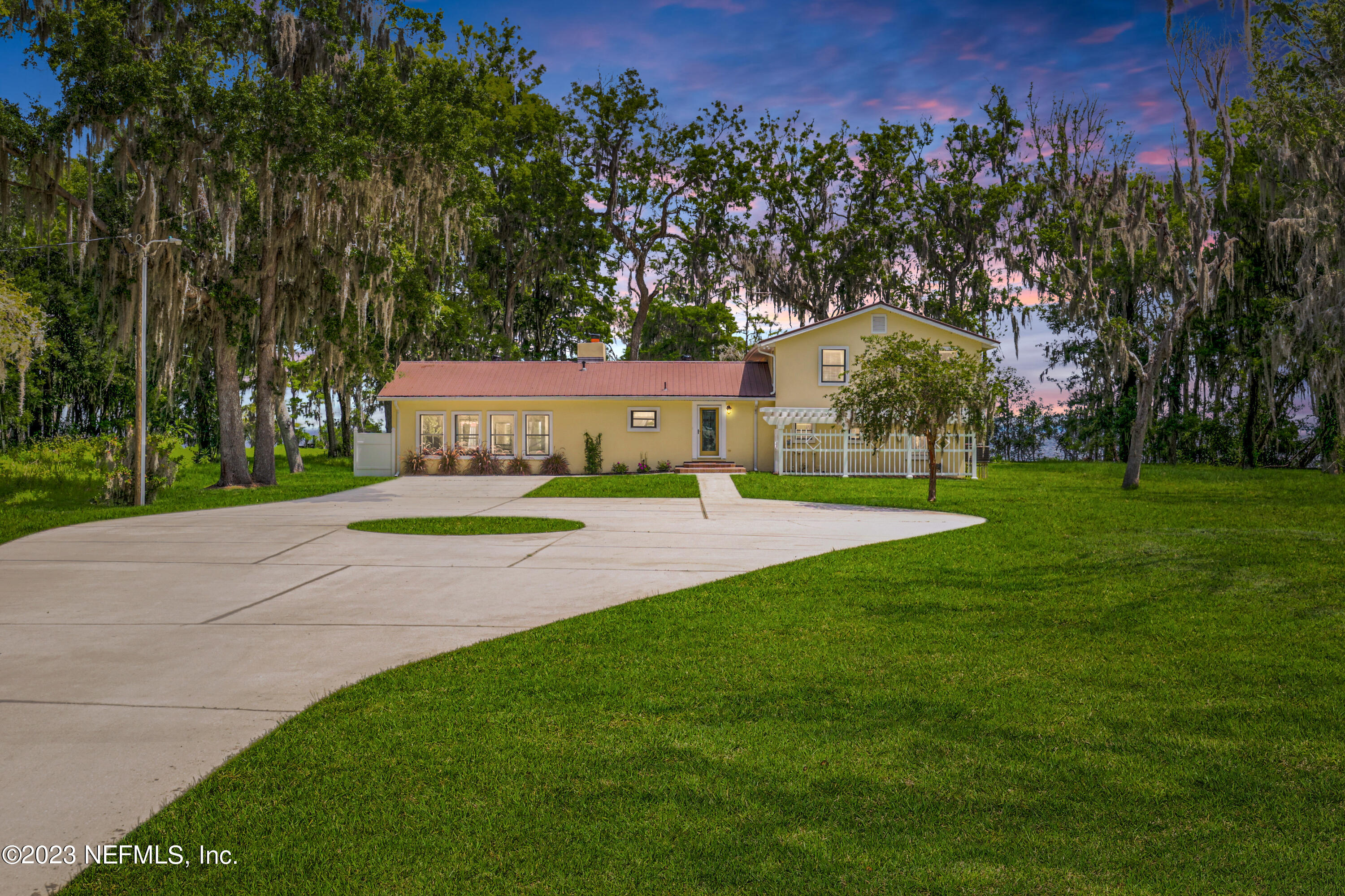 a view of a house with a big yard