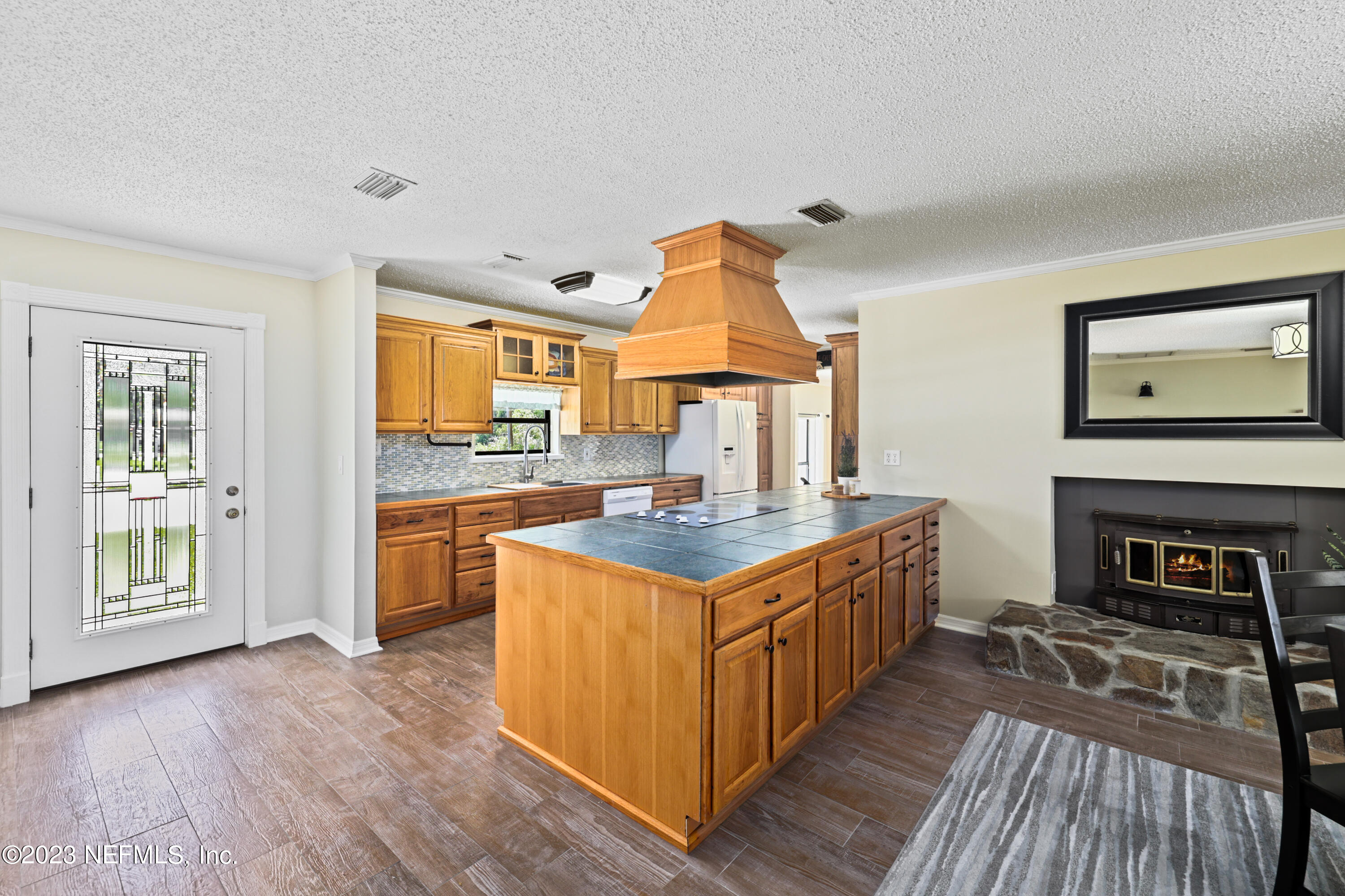 716 Cedar Creek Road Palatka, FL 32177 - Photo 13 of 62 a kitchen with stainless steel appliances granite countertop a stove and a refrigerator