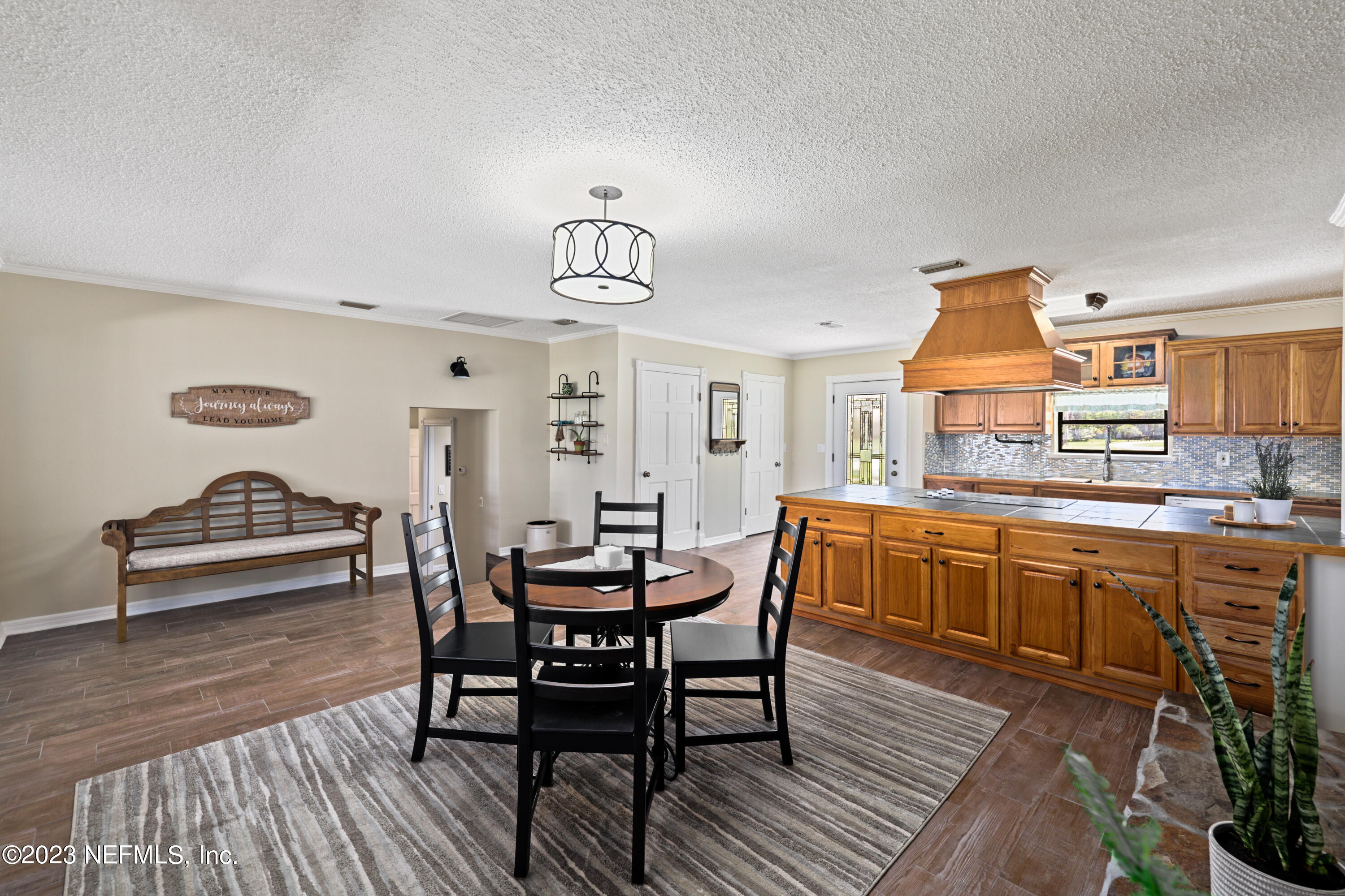 716 Cedar Creek Road Palatka, FL 32177 - Photo 14 of 62 a view of a dining room with furniture and wooden floor