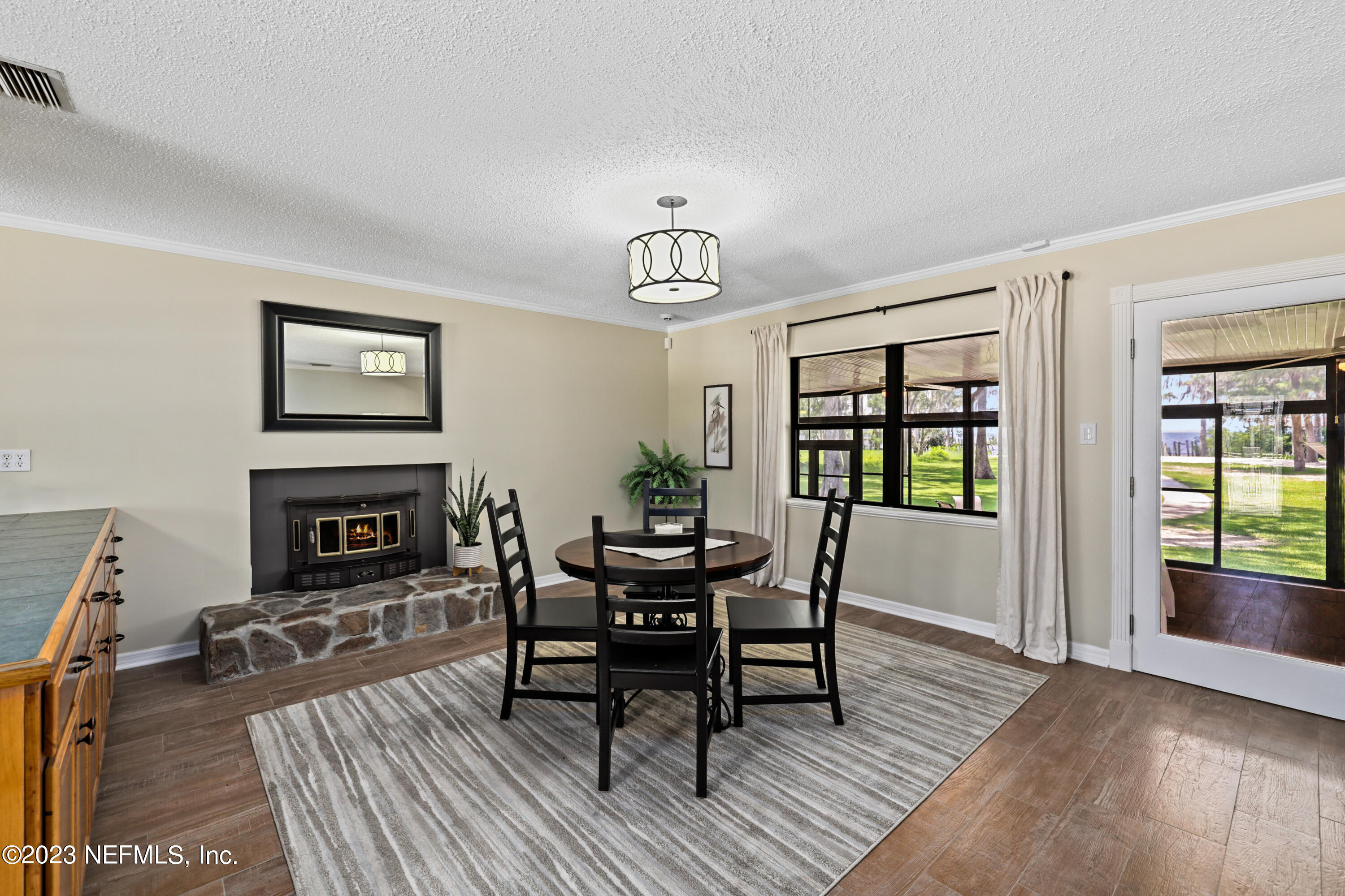 716 Cedar Creek Road Palatka, FL 32177 - Photo 15 of 62 a view of a dining room with furniture and wooden floor