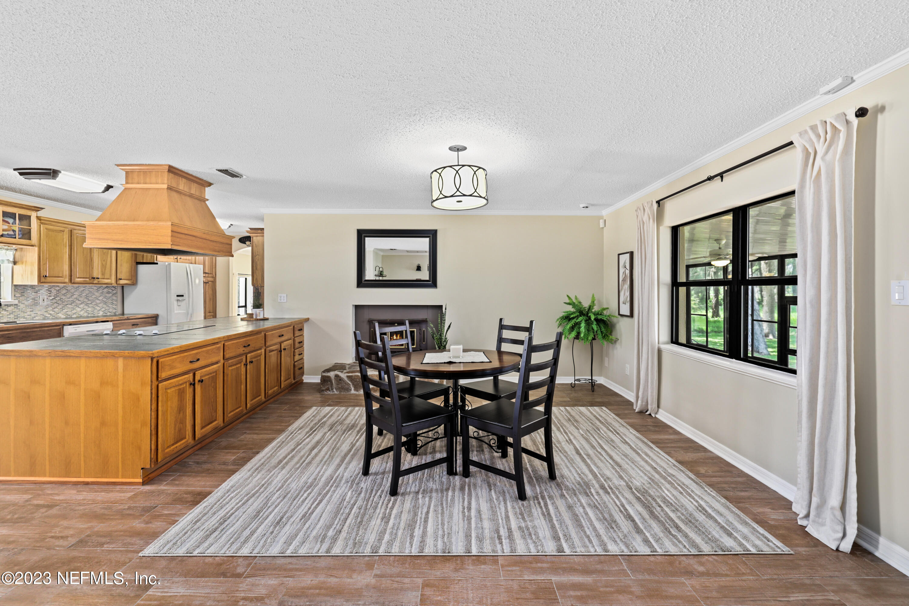 716 Cedar Creek Road Palatka, FL 32177 - Photo 16 of 62 a view of a dining room with furniture and window