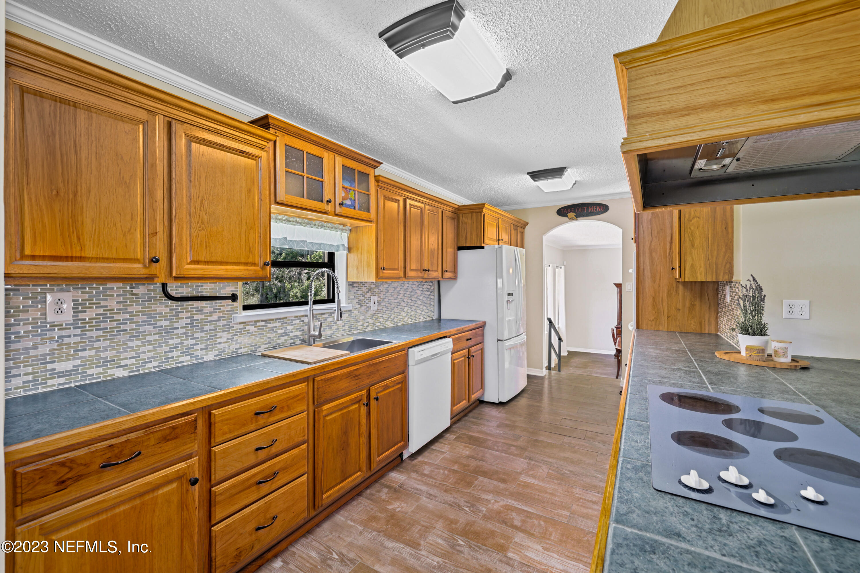 716 Cedar Creek Road Palatka, FL 32177 - Photo 17 of 62 a large kitchen with stainless steel appliances granite countertop a sink and cabinets