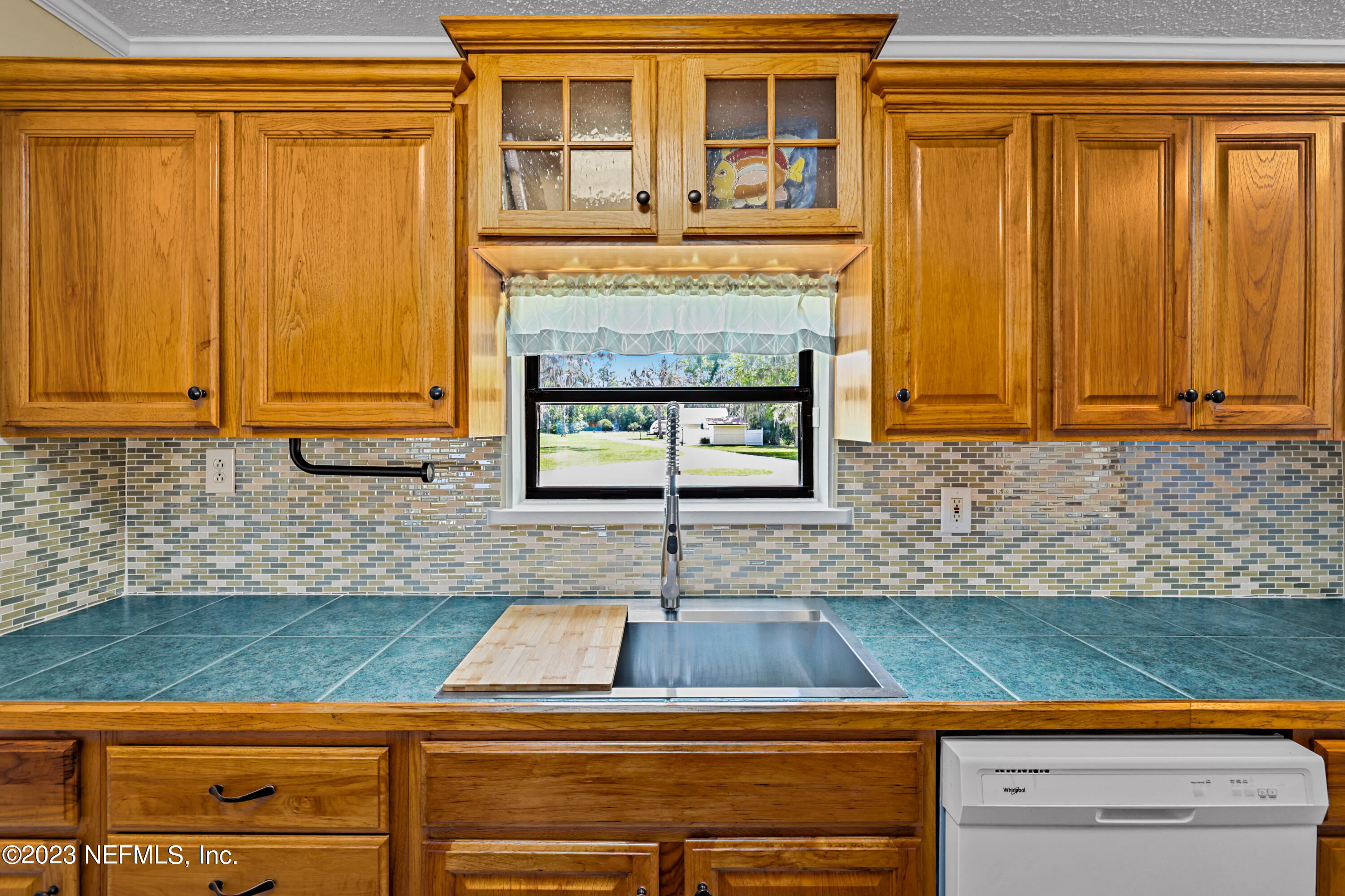 716 Cedar Creek Road Palatka, FL 32177 - Photo 18 of 62 a kitchen with granite countertop cabinets and black stainless steel appliances