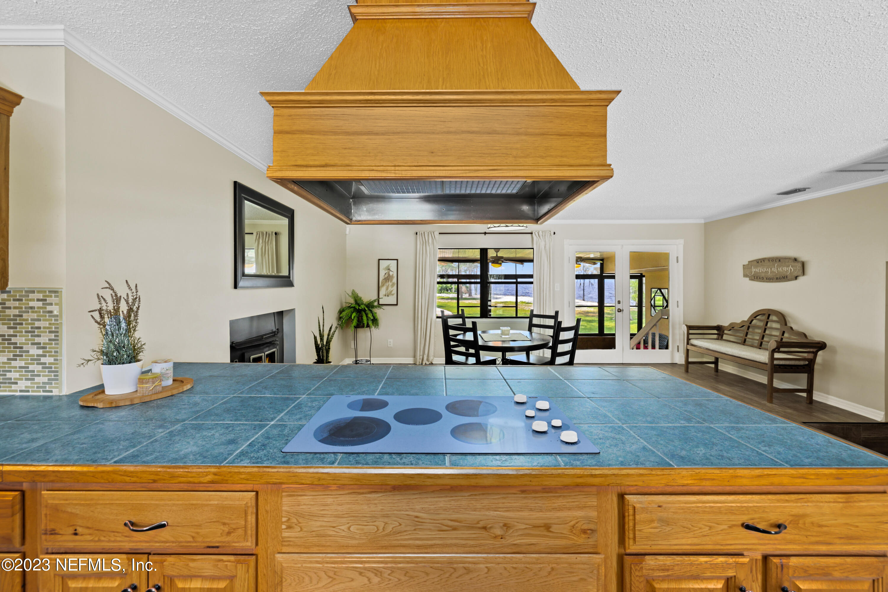 716 Cedar Creek Road Palatka, FL 32177 - Photo 19 of 62 a living room with kitchen furniture and potted plant