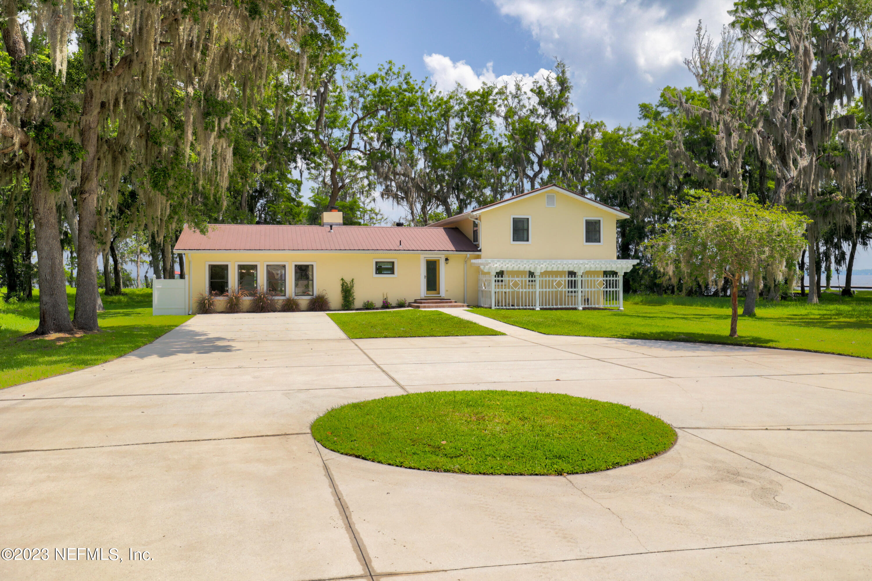 716 Cedar Creek Road Palatka, FL 32177 - Photo 2 of 62 a aerial view of a house with a yard and palm trees