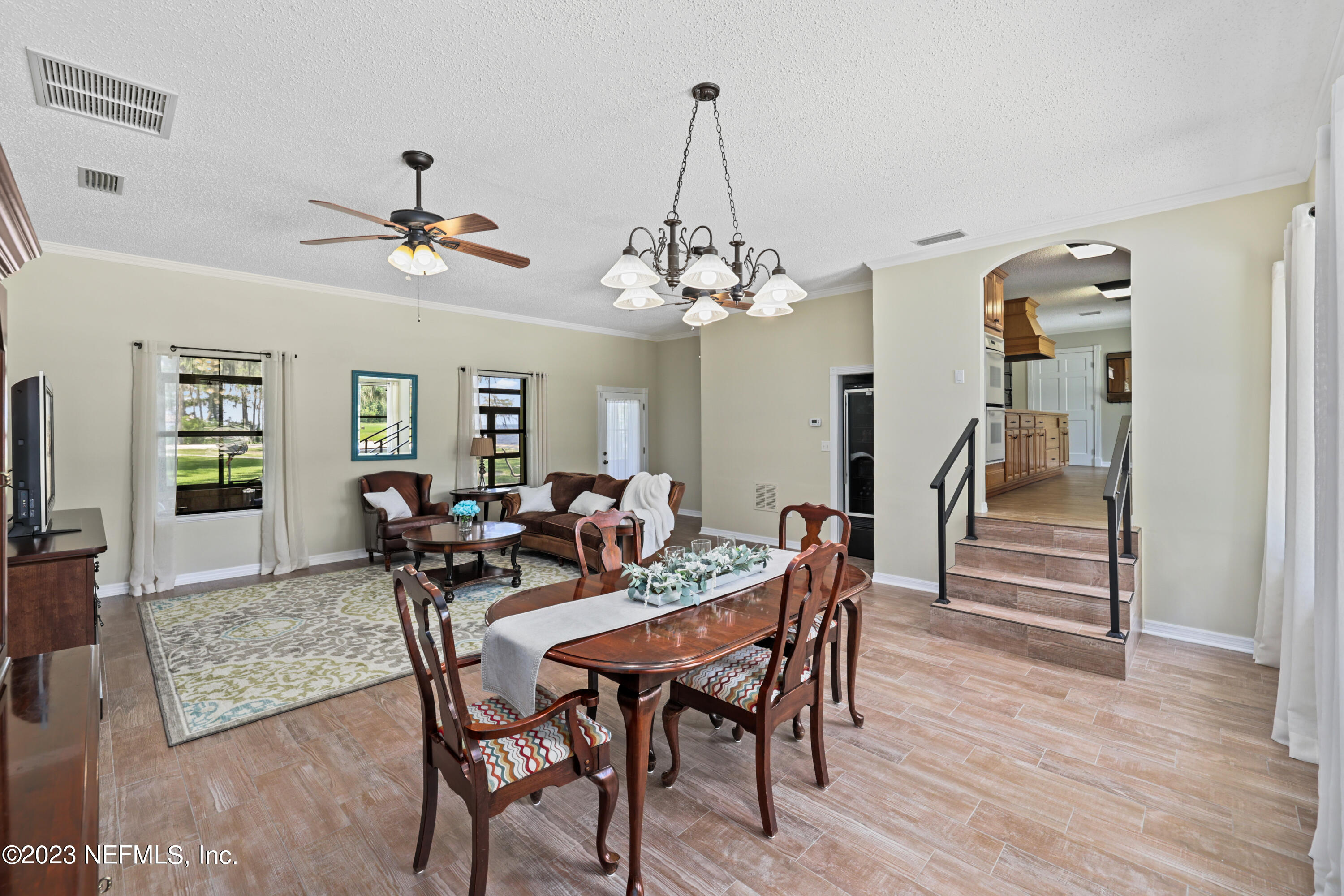 716 Cedar Creek Road Palatka, FL 32177 - Photo 21 of 62 a view of a dining room with furniture and wooden floor