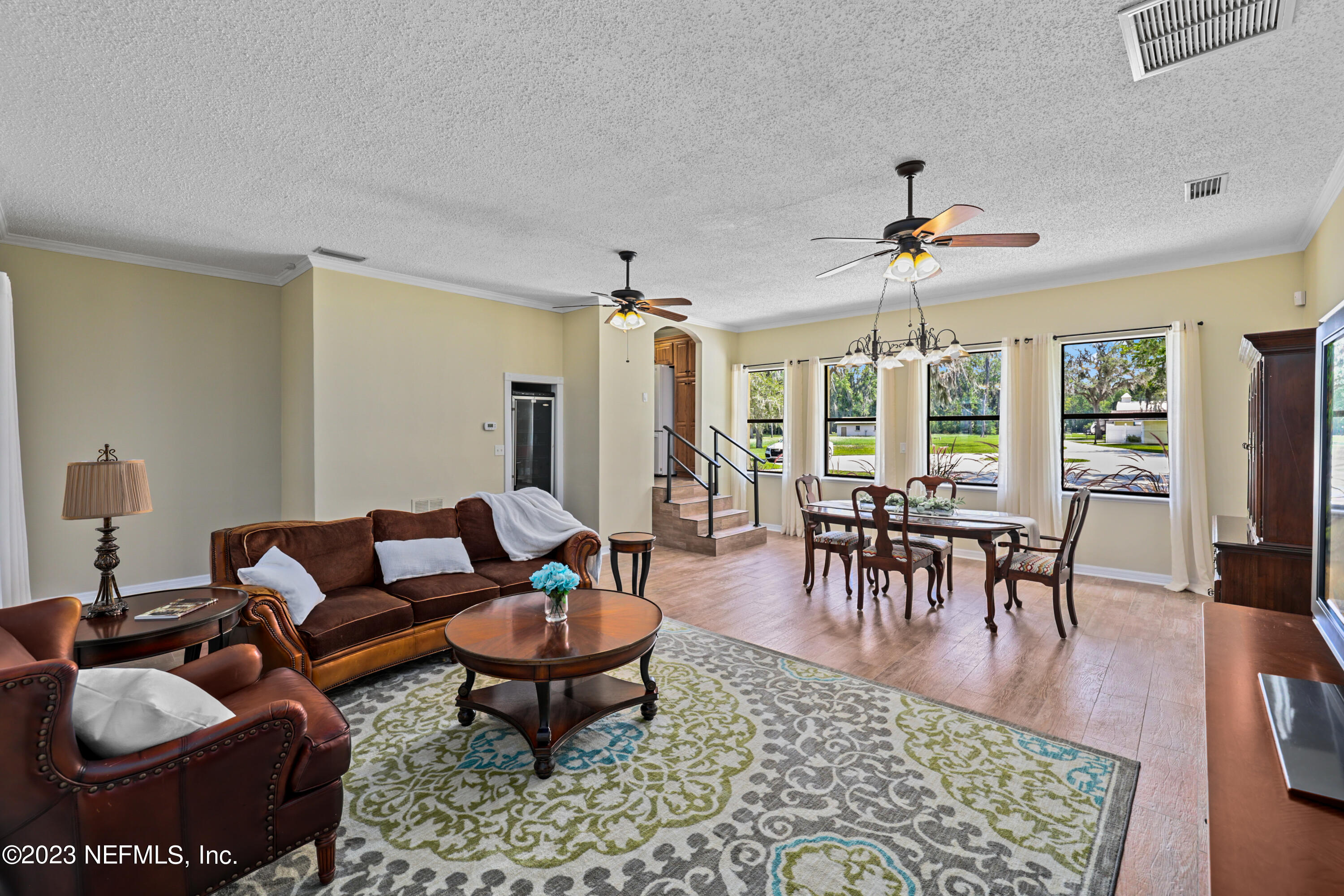 716 Cedar Creek Road Palatka, FL 32177 - Photo 23 of 62 a living room with furniture and a dining table
