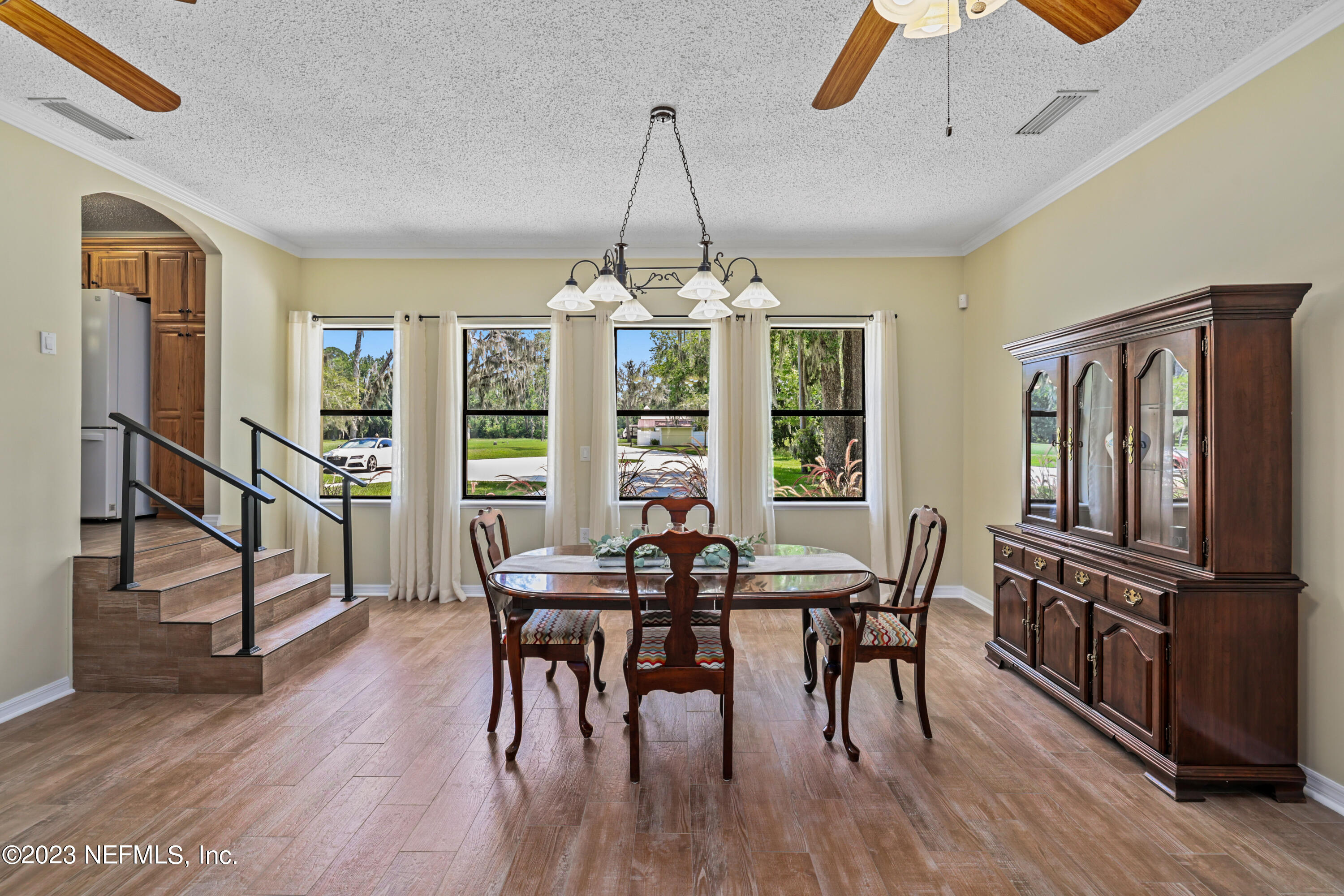 716 Cedar Creek Road Palatka, FL 32177 - Photo 24 of 62 a view of a dining room with furniture window and wooden floor