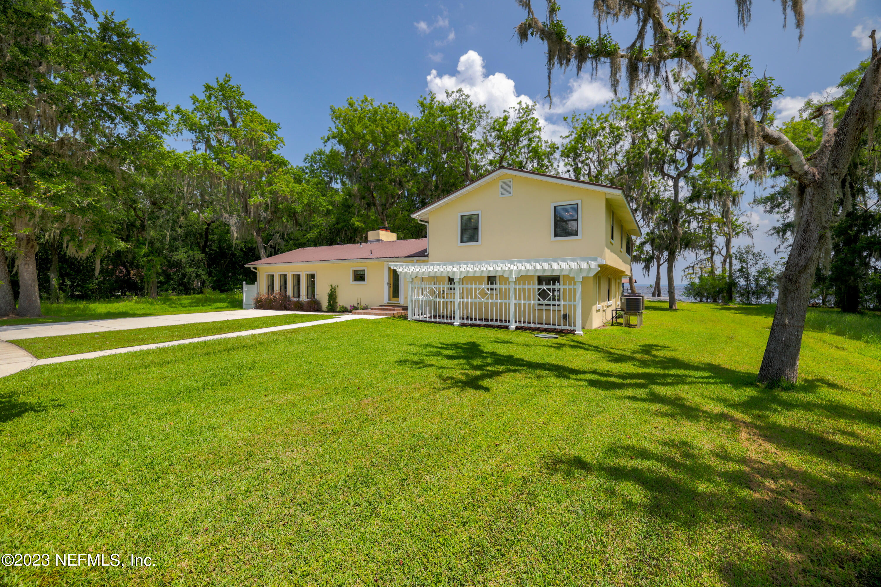 716 Cedar Creek Road Palatka, FL 32177 - Photo 3 of 62 a front view of a house with garden