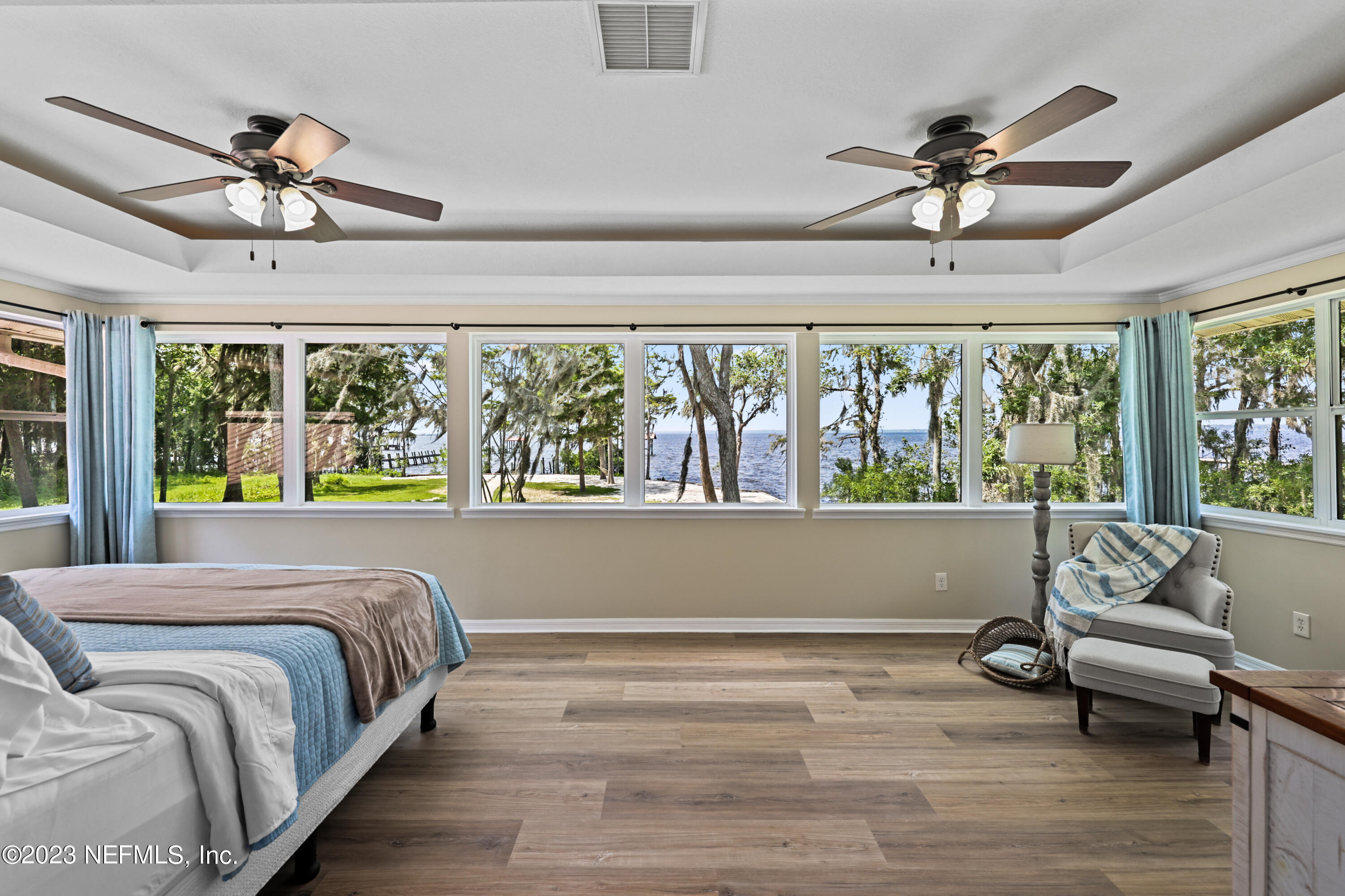 716 Cedar Creek Road Palatka, FL 32177 - Photo 33 of 62 a spacious bedroom with a bed and wooden floor